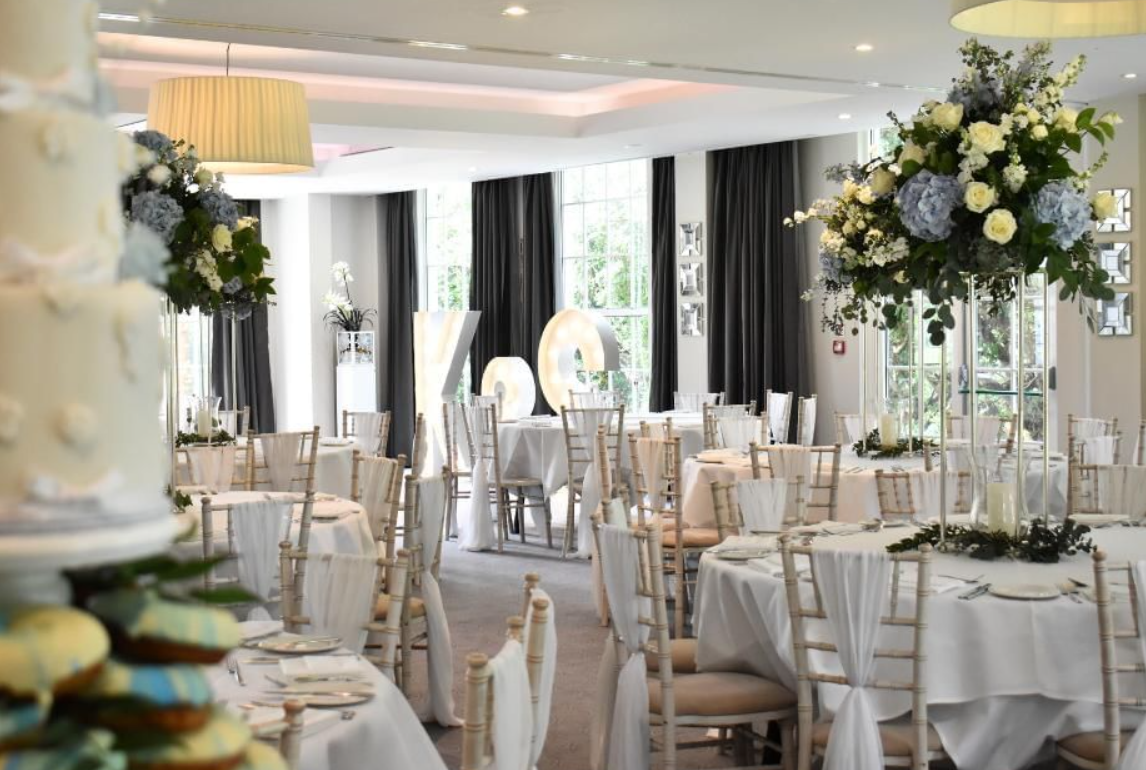 Elegant wedding setup at Gorse Hill Hotel with floral centerpieces and soft lighting.
