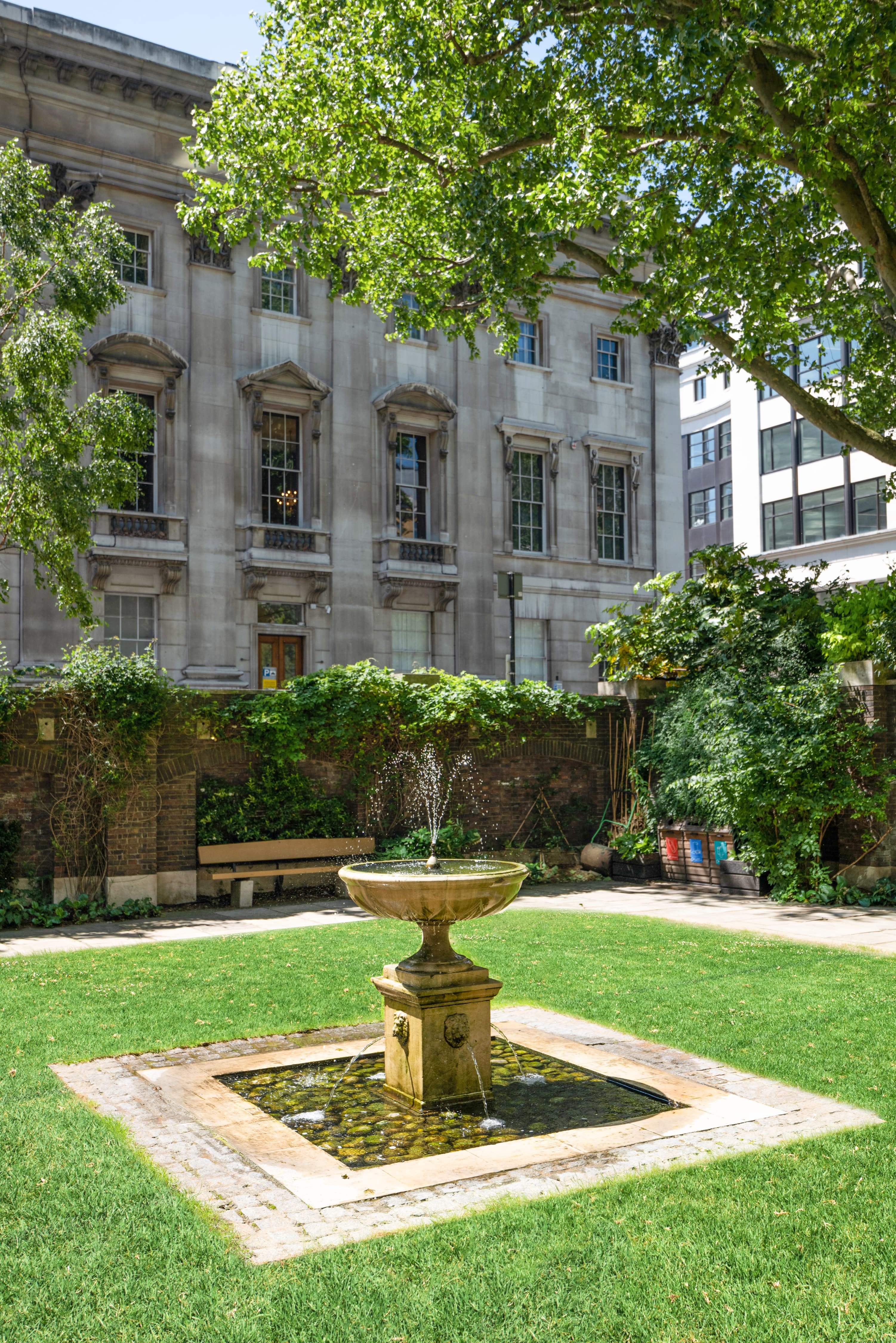 Goldsmiths' Garden with decorative fountain, ideal for summer events and gatherings.