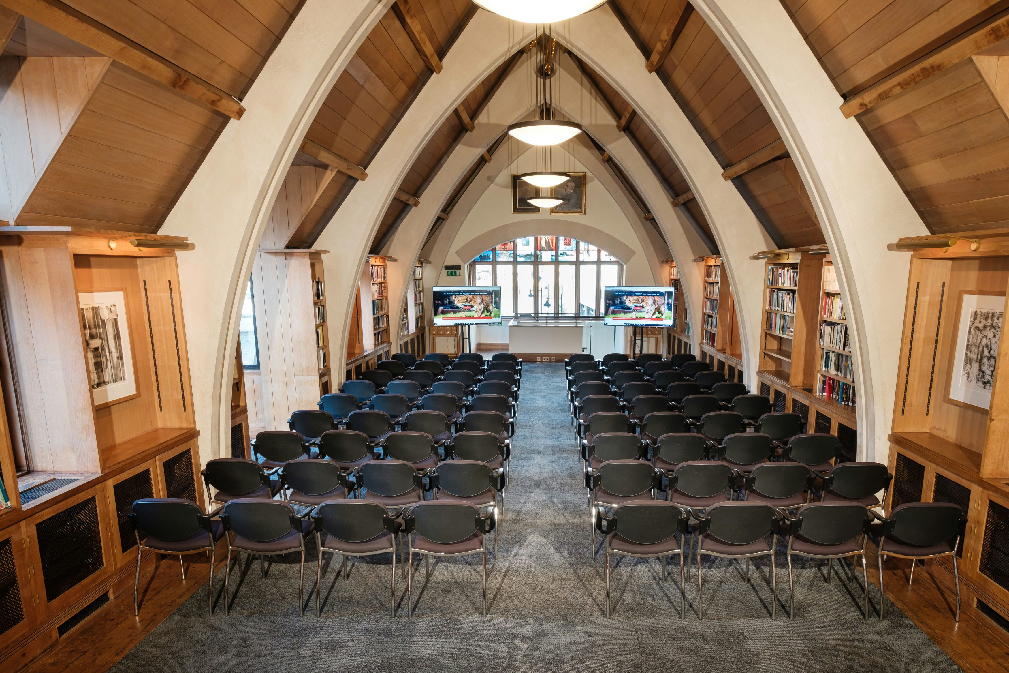 Garry Weston Library event space with black chairs, ideal for presentations and meetings.