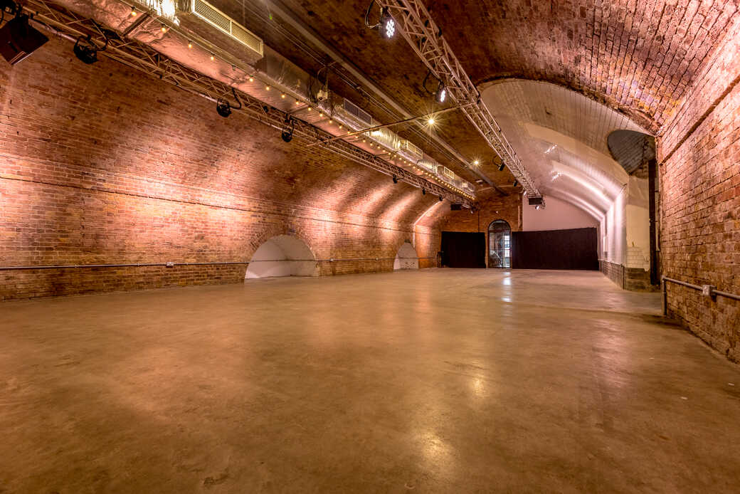 Versatile Kachette venue with exposed brick, perfect for corporate and social events.