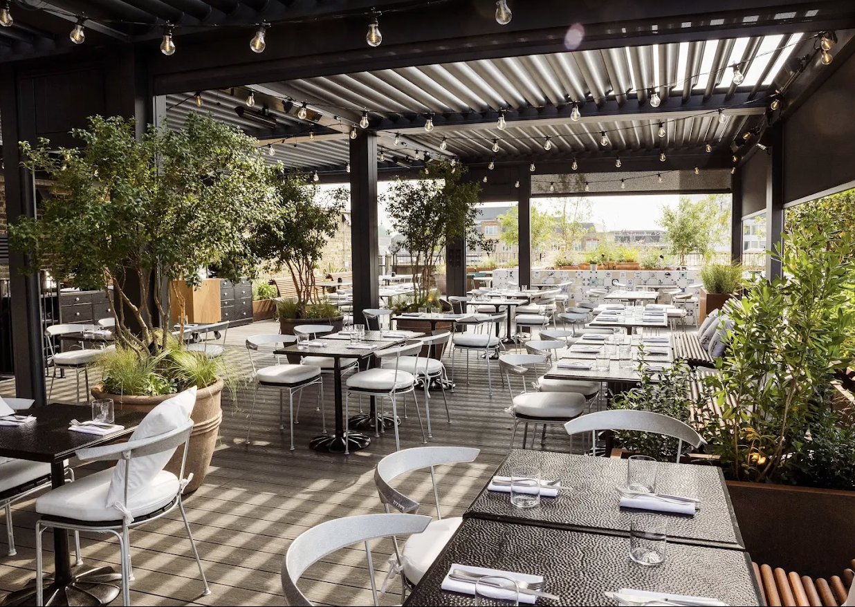 Modern outdoor venue with sleek seating for events and meetings at The Conduit.