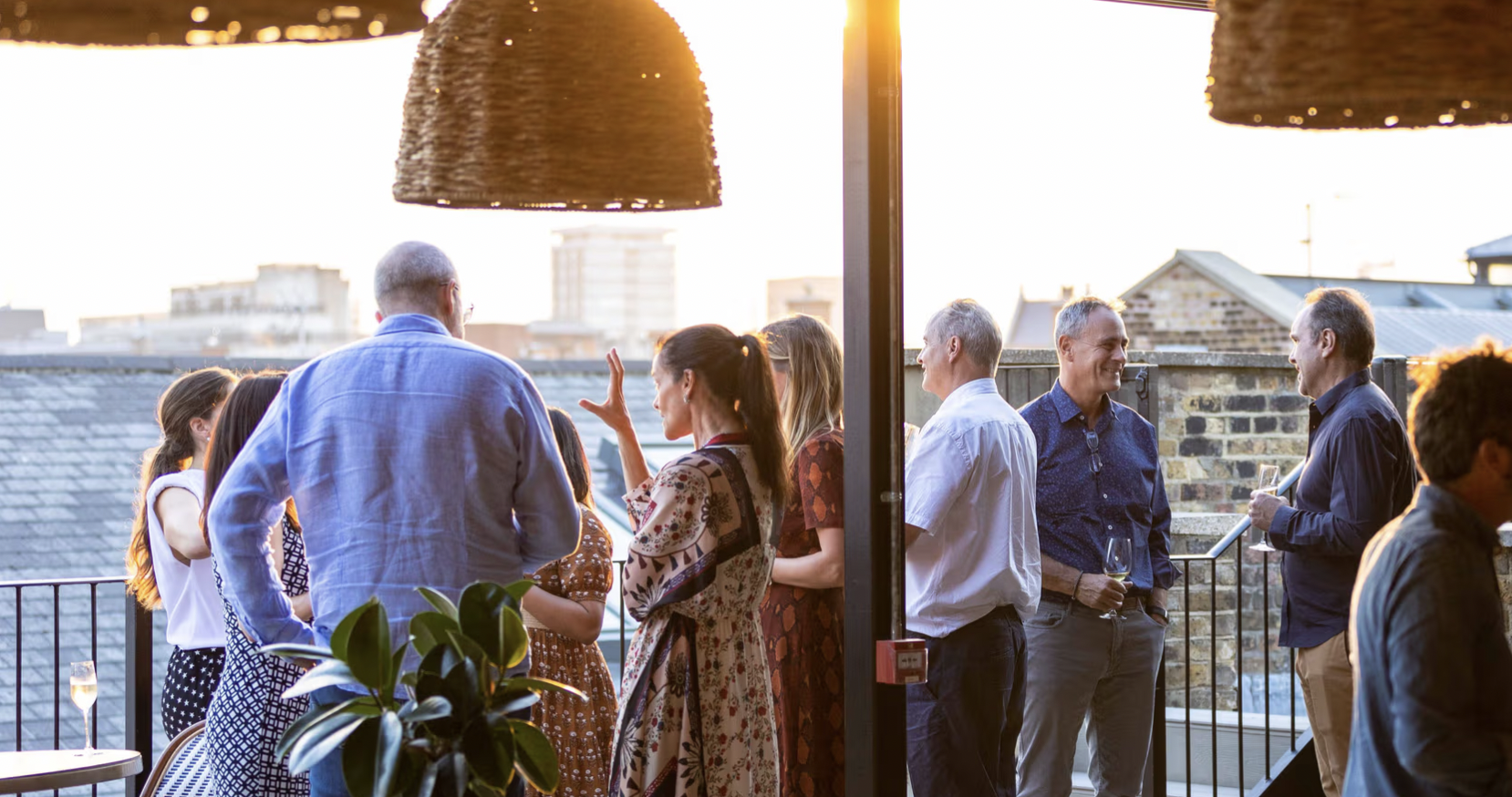 Vibrant rooftop networking event at The Conduit, perfect for meetings and gatherings.
