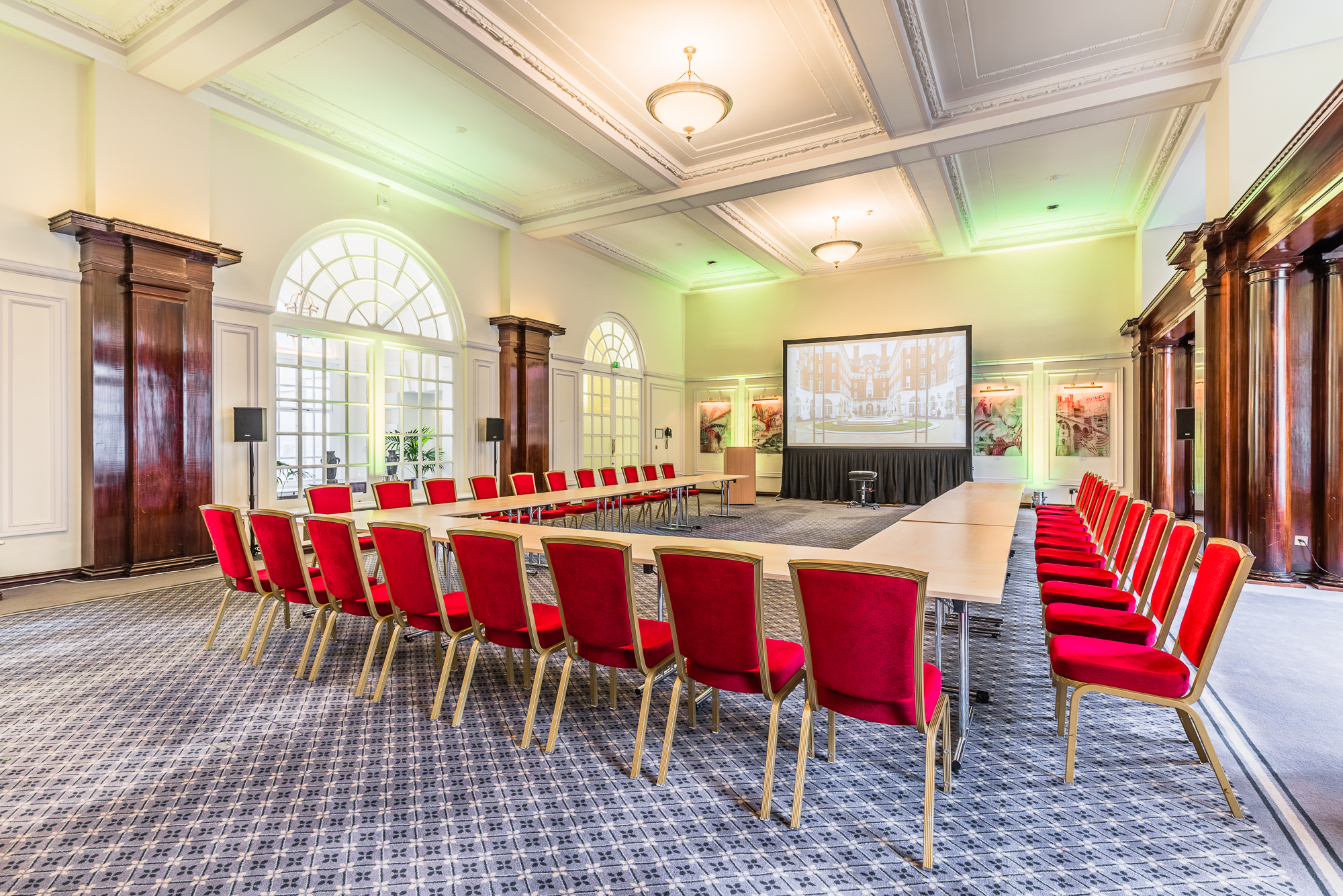 Low-Impact DDR at BMA House: bright meeting room with large table and red chairs for corporate events.