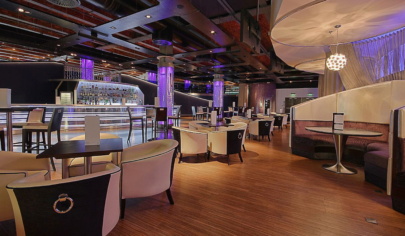Icon Lounge at Manchester235: modern event space with stylish bar for upscale gatherings.