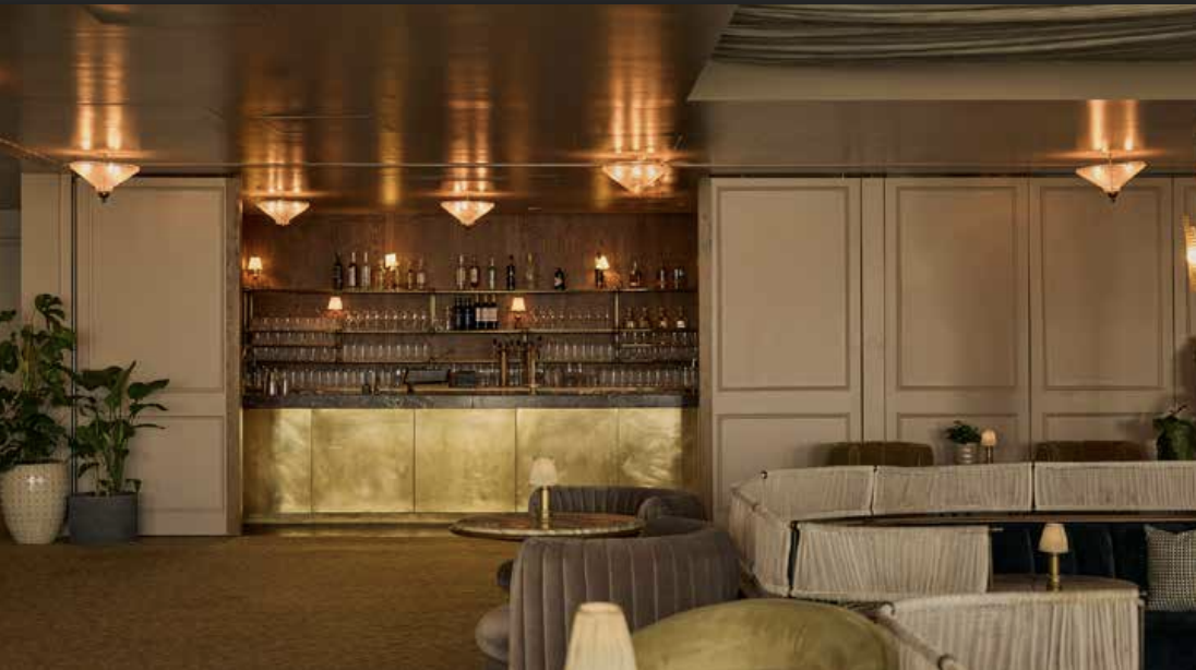 Elegant event venue Studio 8 with inviting bar for networking or intimate gatherings.