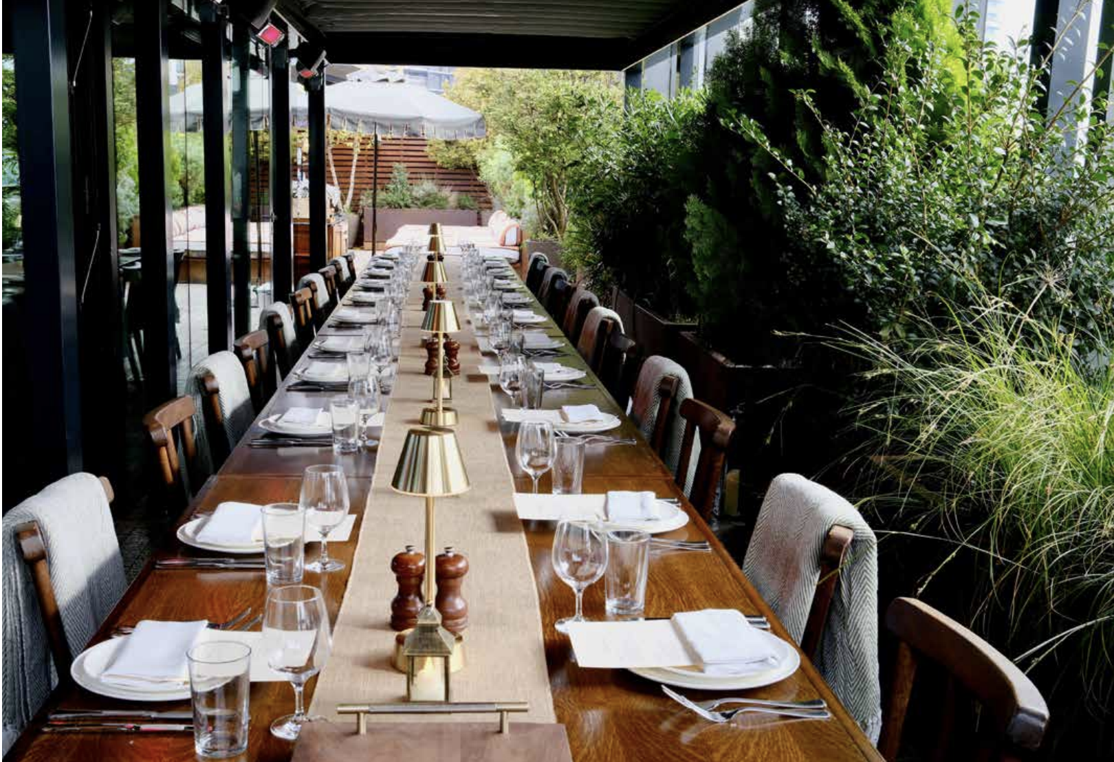Elegant long table setup in Studio 8 for networking events and intimate receptions.