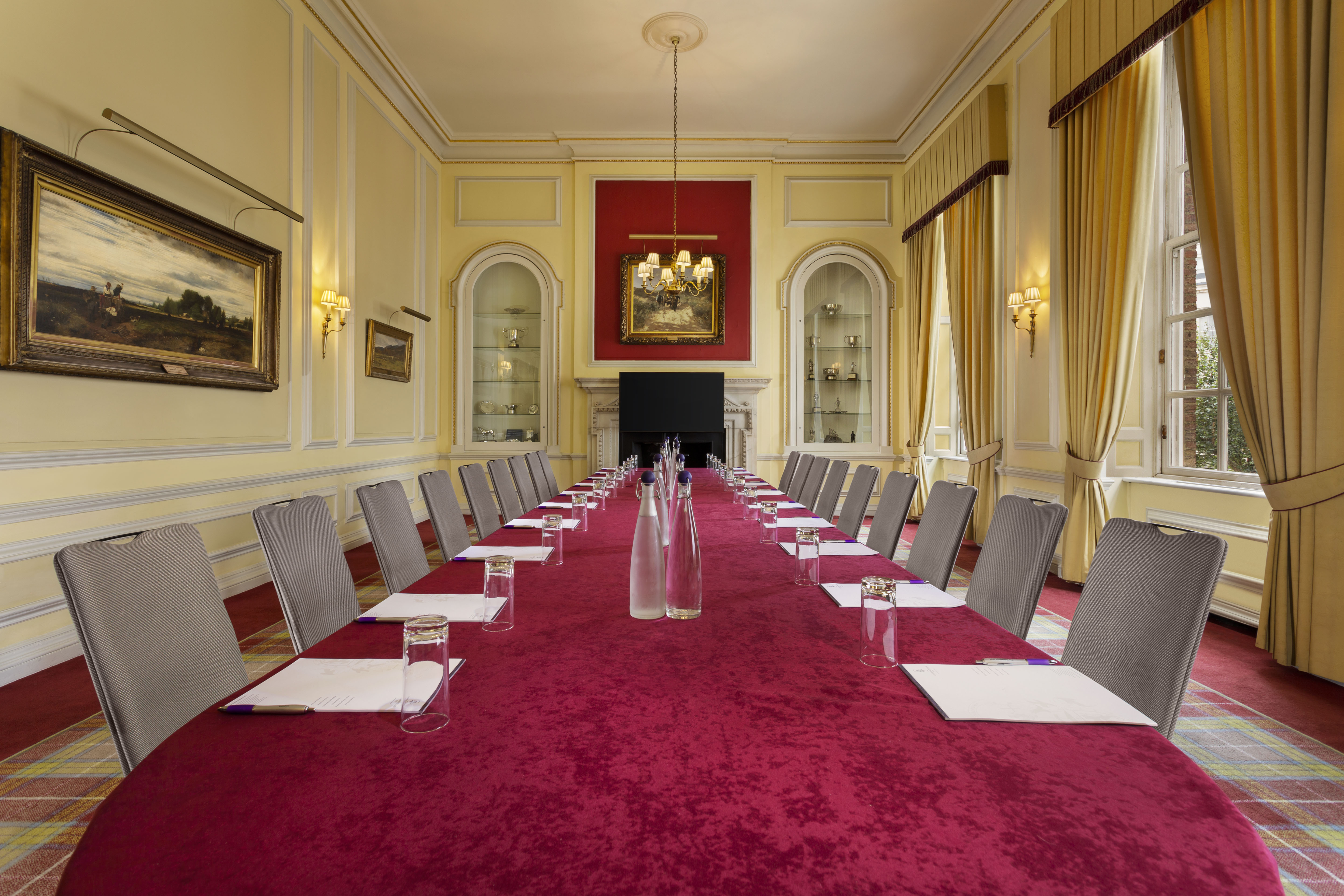 Caledonian Club boardroom, red table, executive meetings