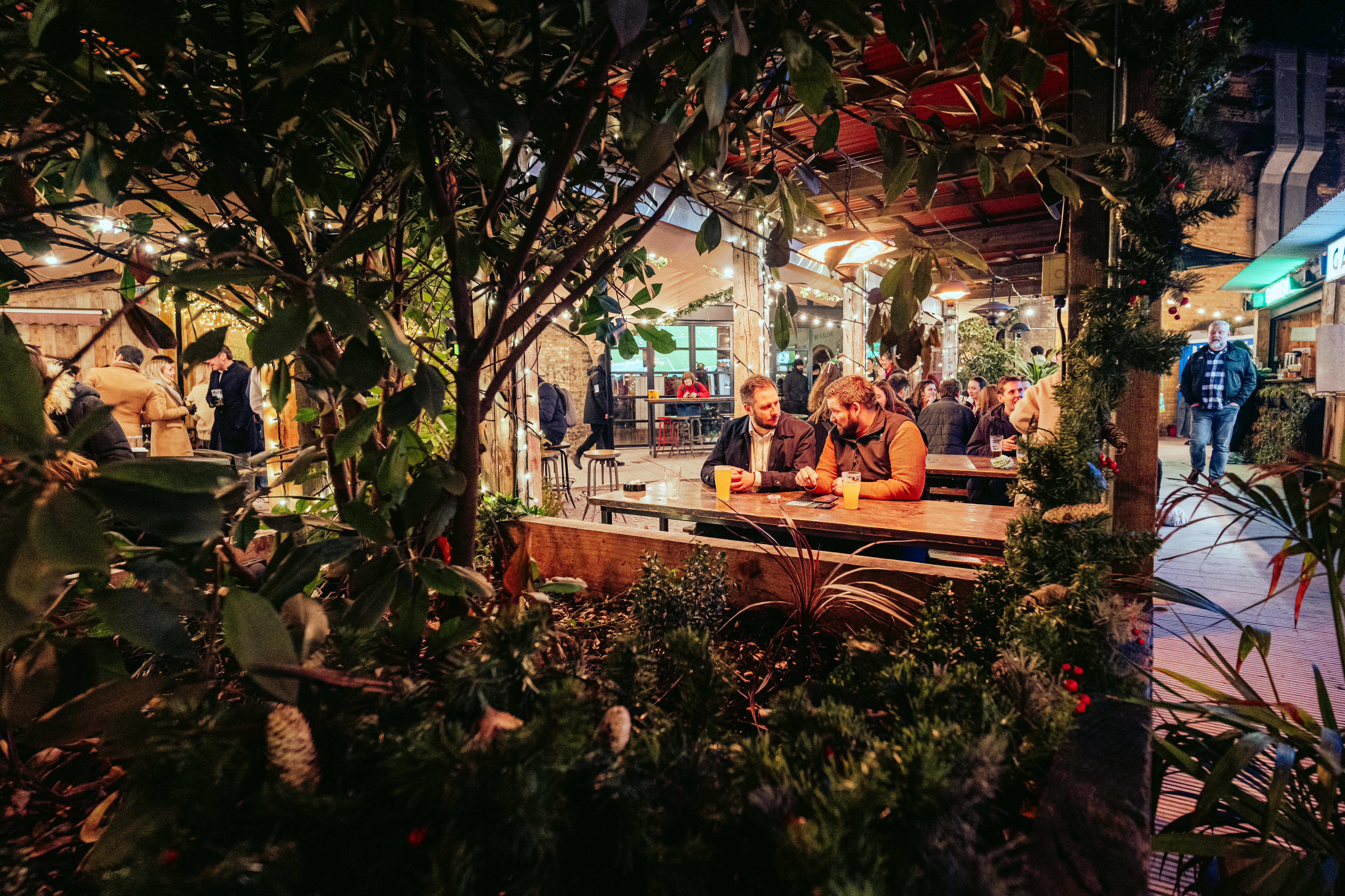 Vibrant Flat Iron Square outdoor event space with lush greenery for gatherings.