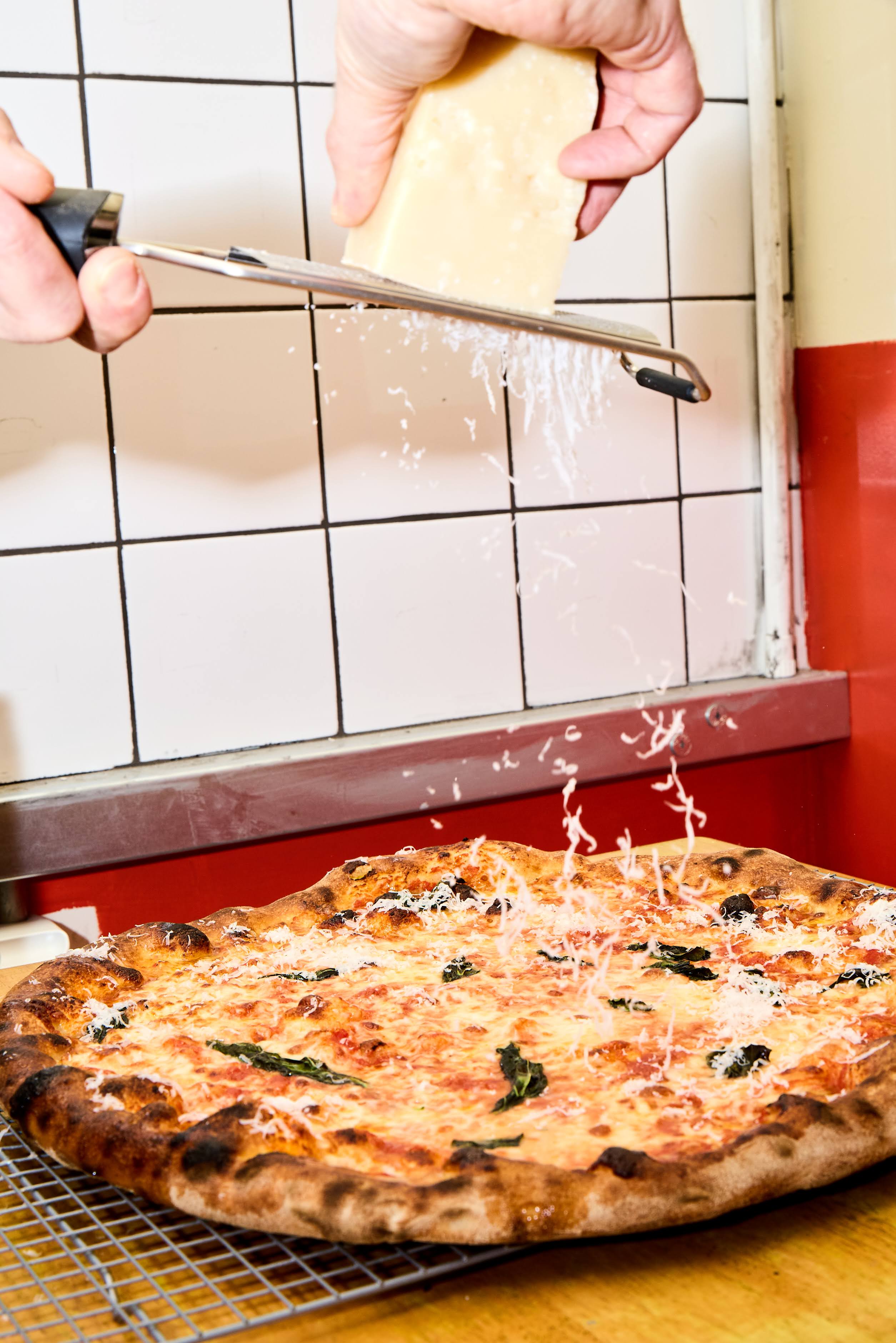 Freshly baked pizza with melted cheese at SpringSt Pizza, perfect for event catering.