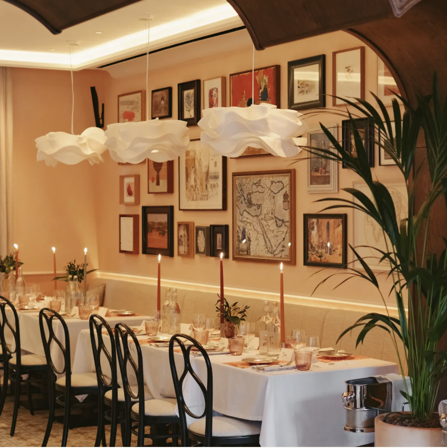 Elegant restaurant dining setup with candle holders for private events in Leydi.