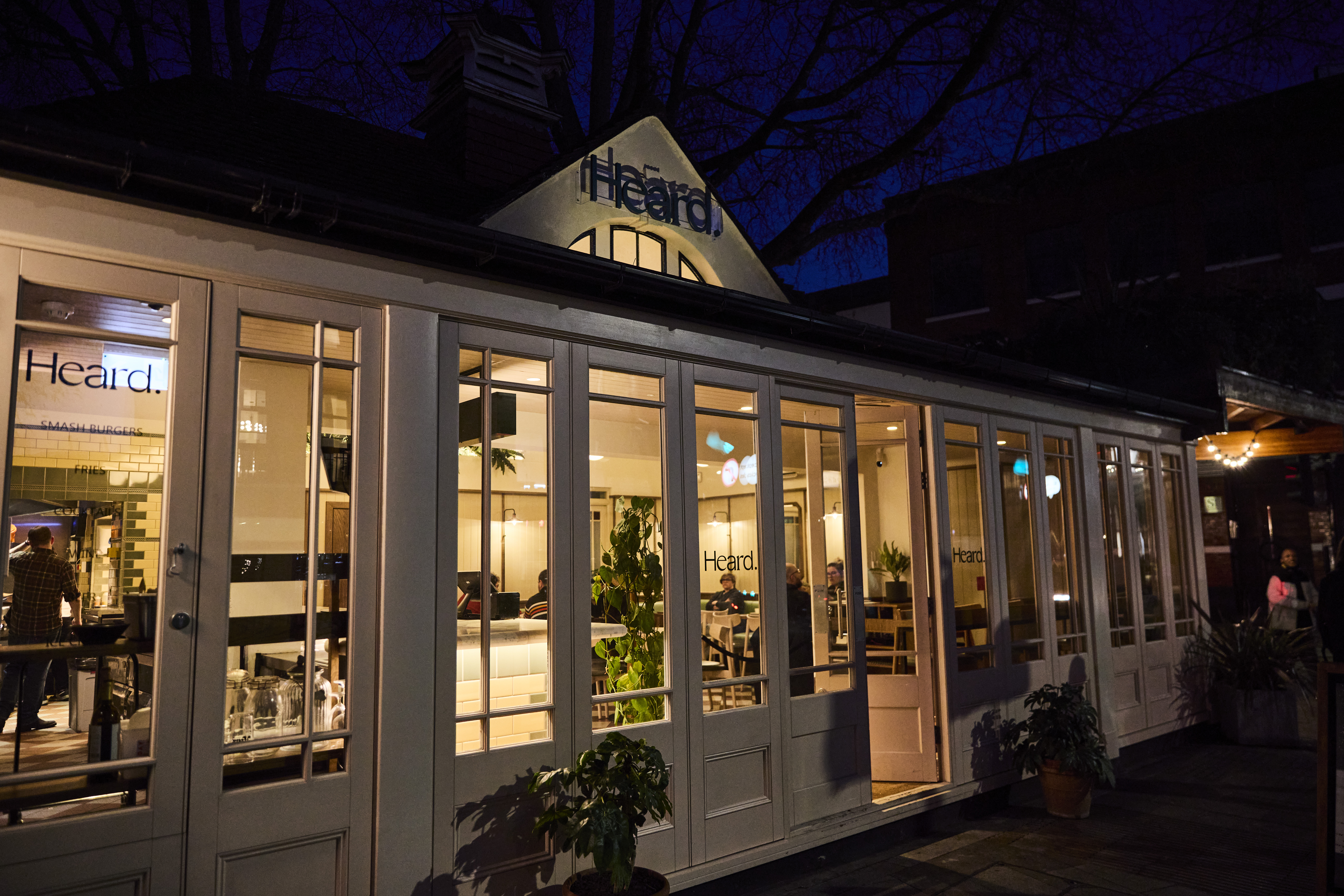 Cozy Heard Burger venue with large windows for corporate dinners and intimate gatherings.