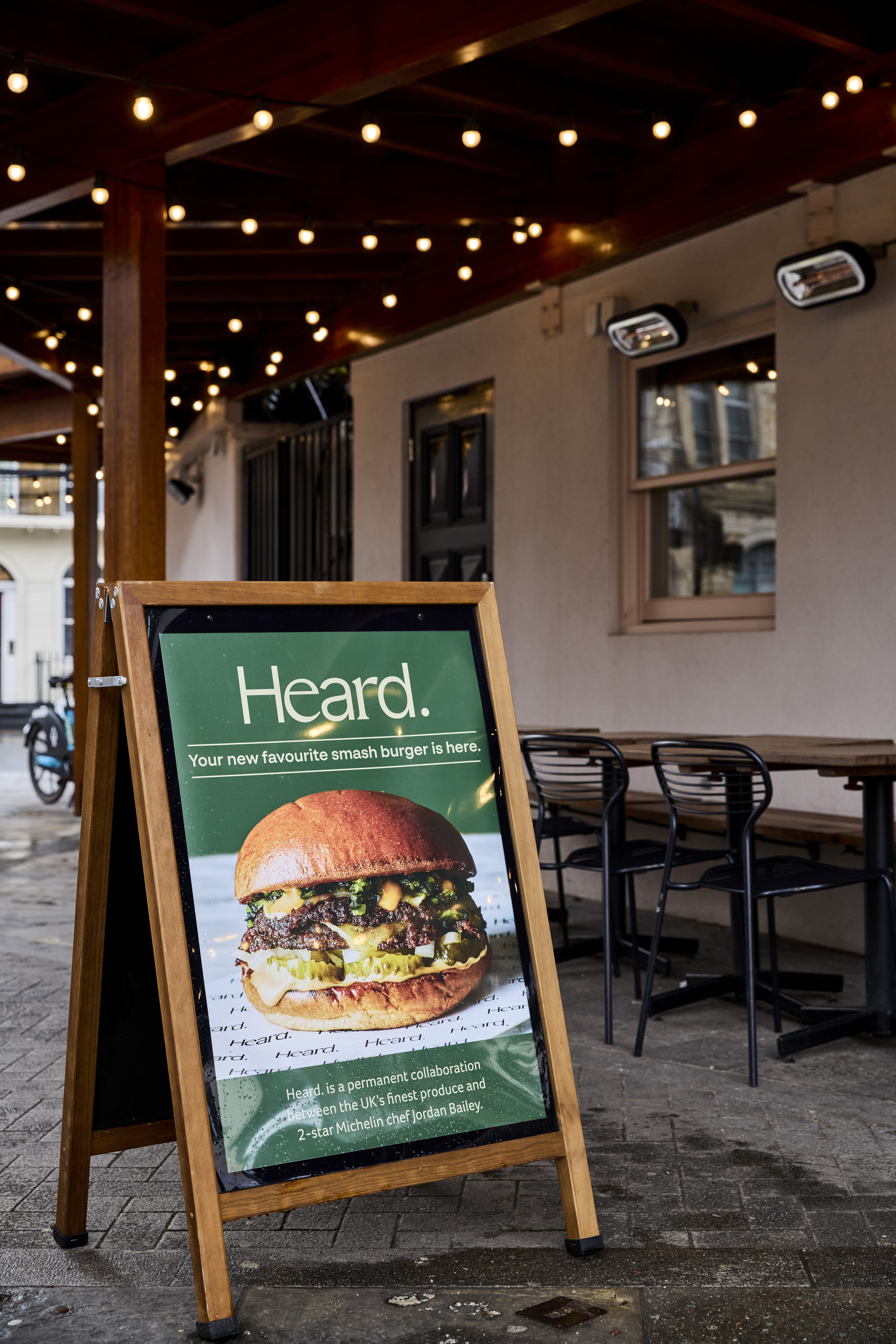Heard Burger's outdoor sign promotes their new smash burger for casual dining events.