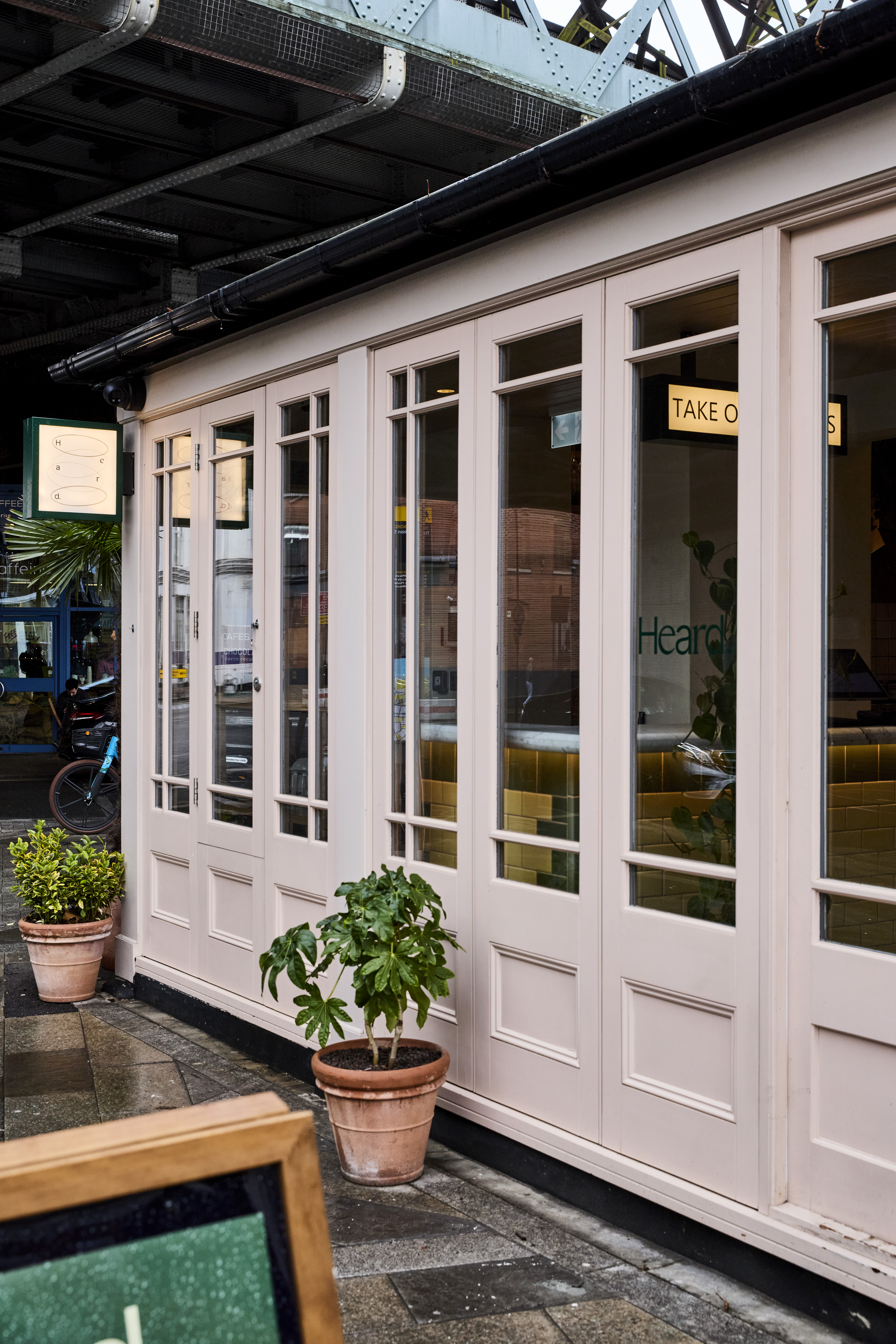 Modern venue entrance at Heard Burger, ideal for events and meetings with natural light.