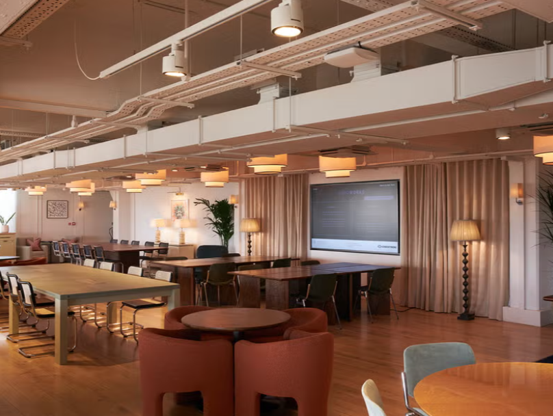 Spacious modern meeting room in Shoreditch with natural light for corporate events.