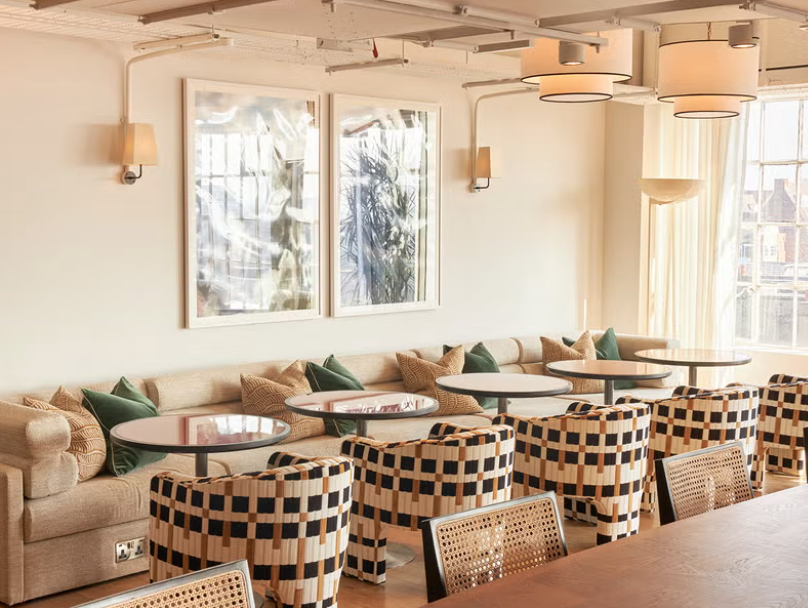 Stylish Shoreditch loft meeting space with cozy seating for networking events.