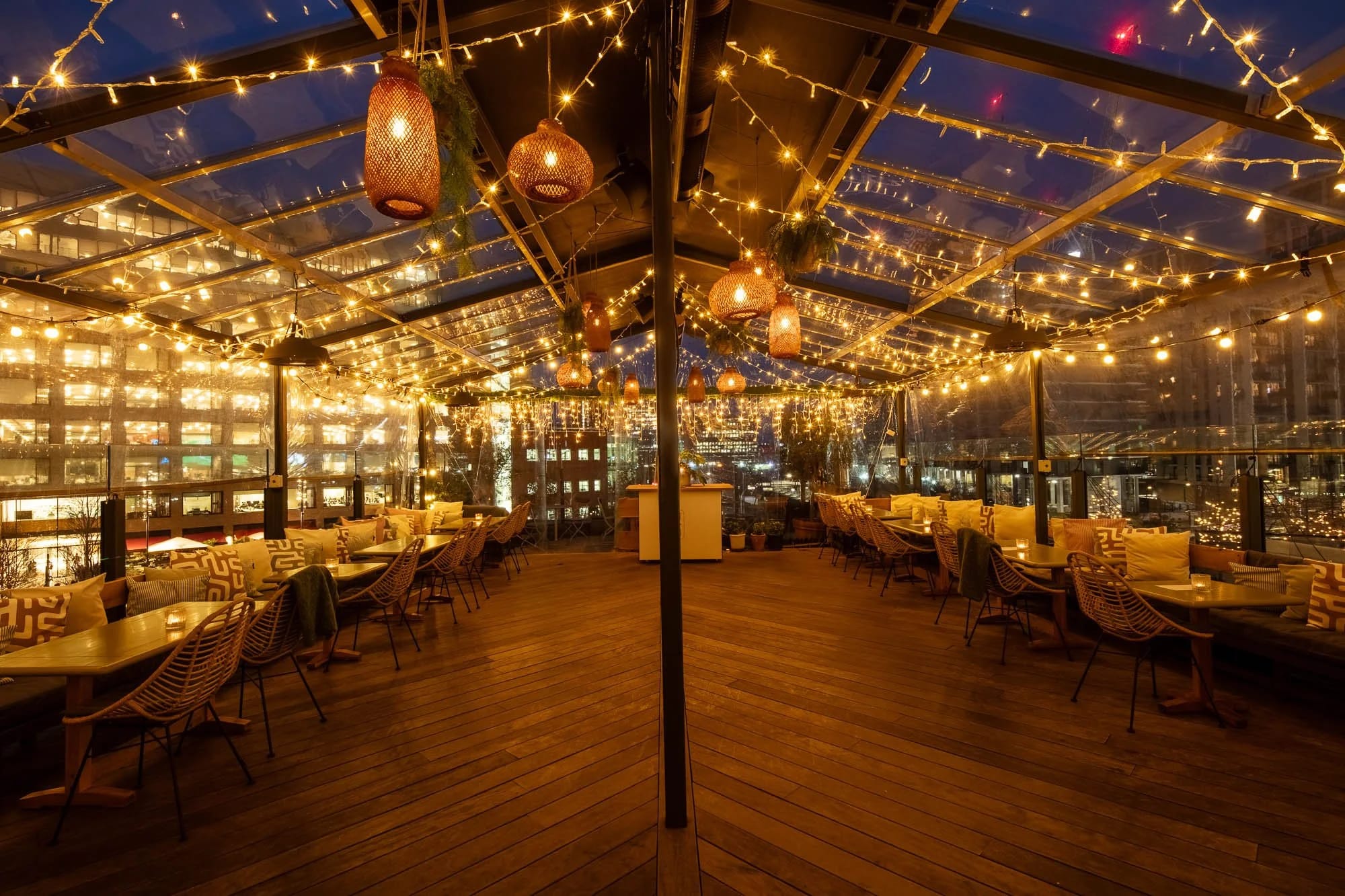 Glass-enclosed rooftop Playroom at The Broadcaster for networking events and cocktail receptions.