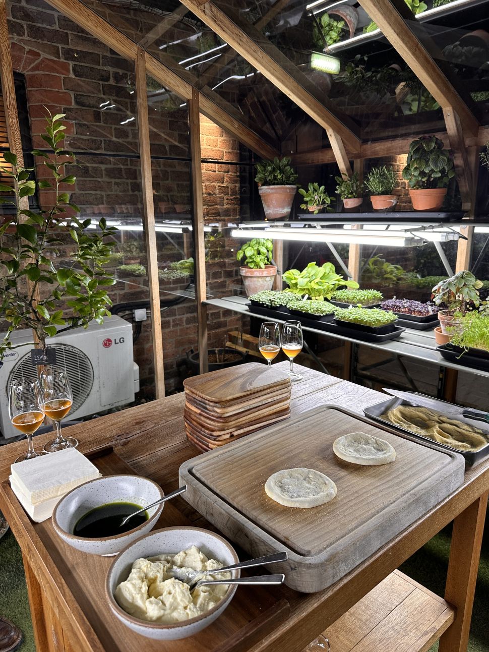 Kitchen bench with fresh produce in Restaurant Sat Bains for gourmet events.