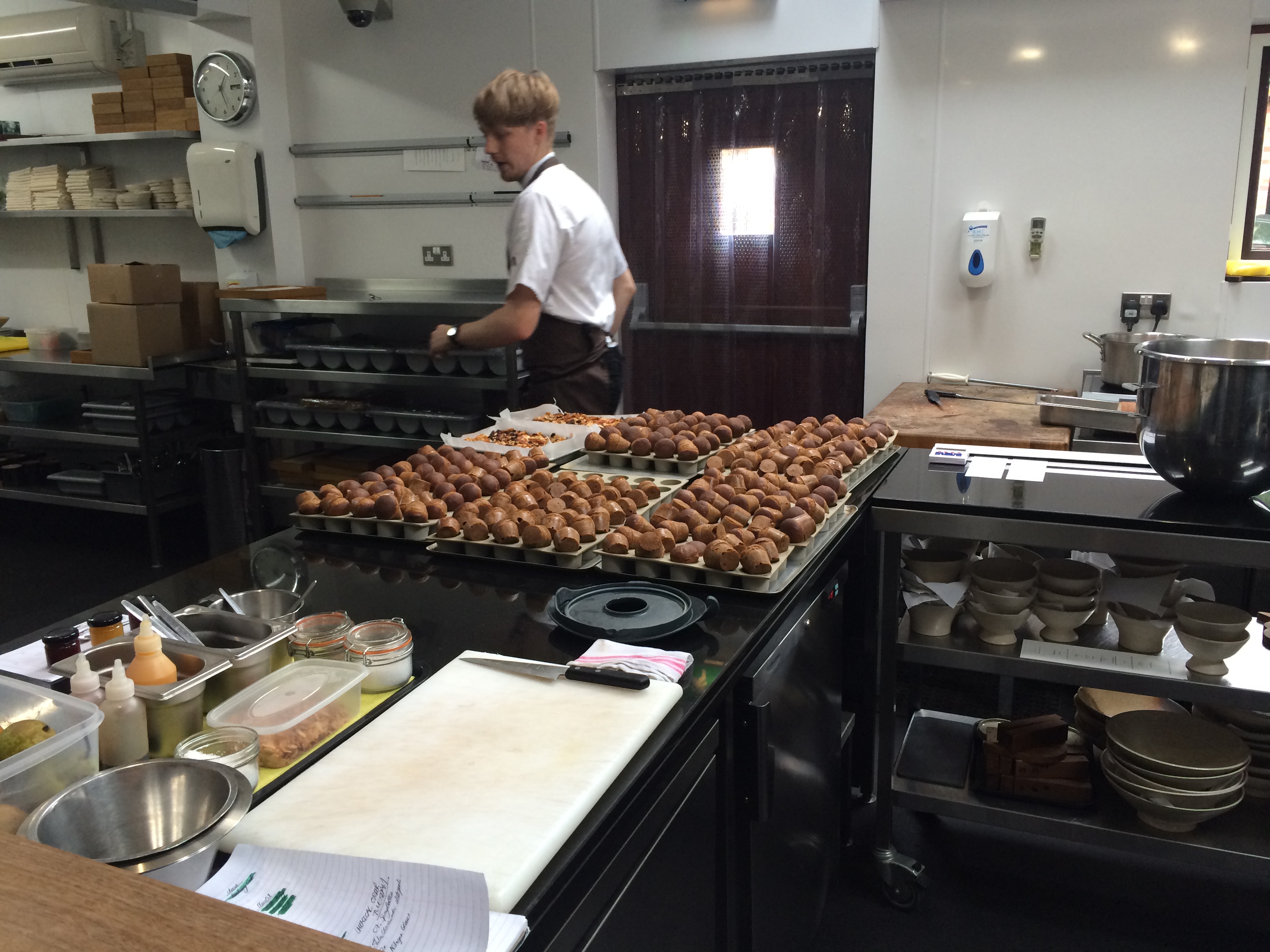 Kitchen bench with pastries ready for events at Restaurant Sat Bains.