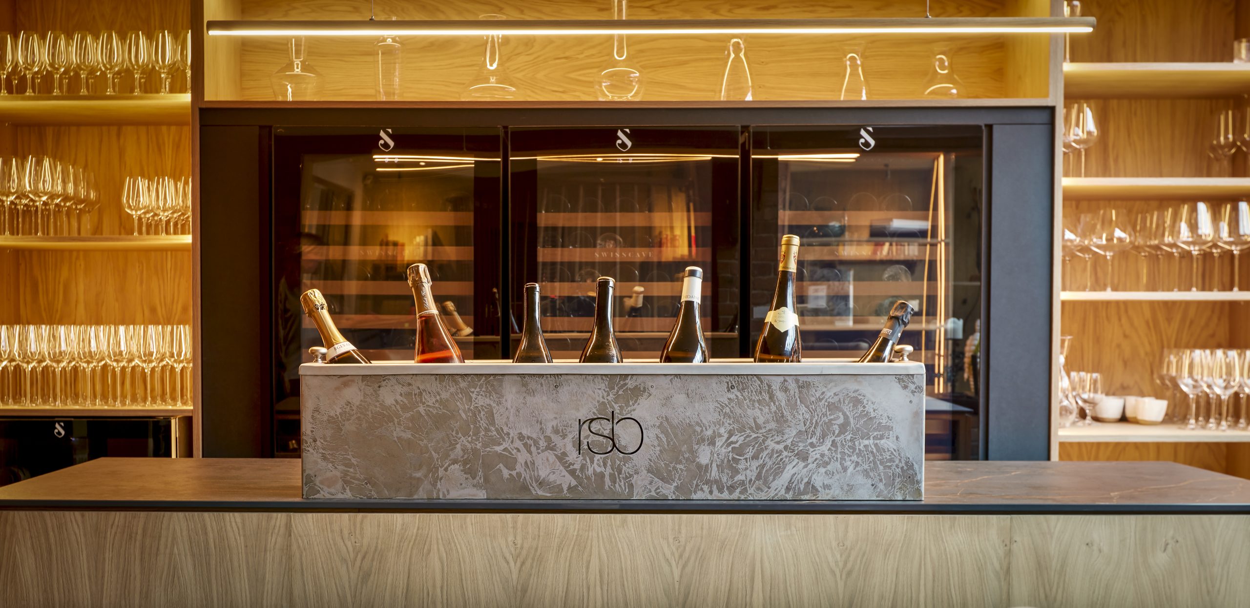 Elegant Lounge Bar at Sat Bains: sophisticated wine display for upscale events.