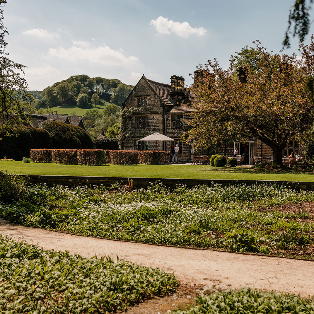 Courtyard Garden at Sat Bains: Stone house, lush greenery, ideal for weddings and events.