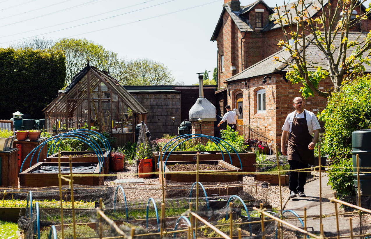 Courtyard Garden at Restaurant Sat Bains, lush greenery, ideal for outdoor events and workshops.