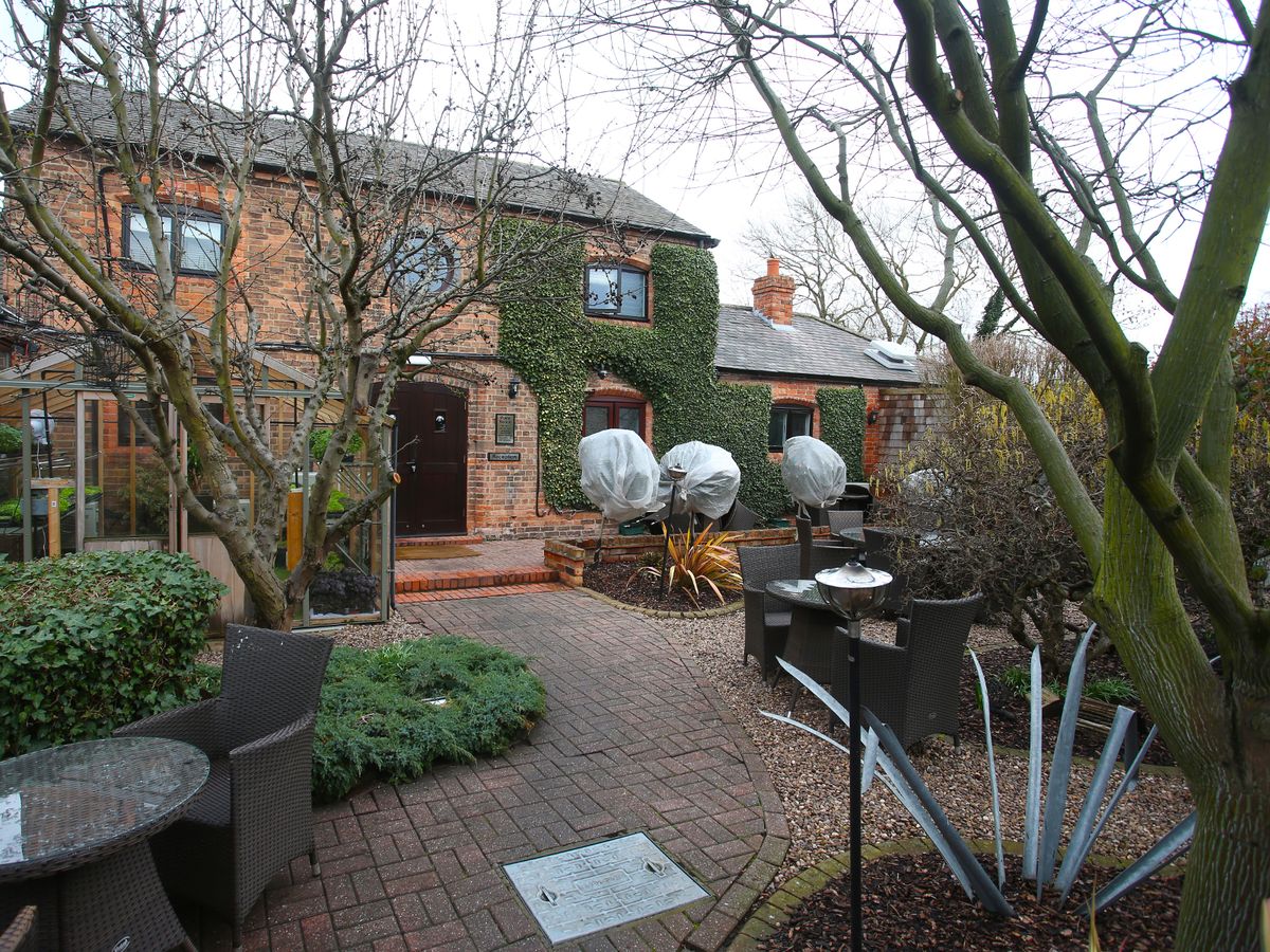 Charming Courtyard Garden at Restaurant Sat Bains, ideal for outdoor weddings and gatherings.