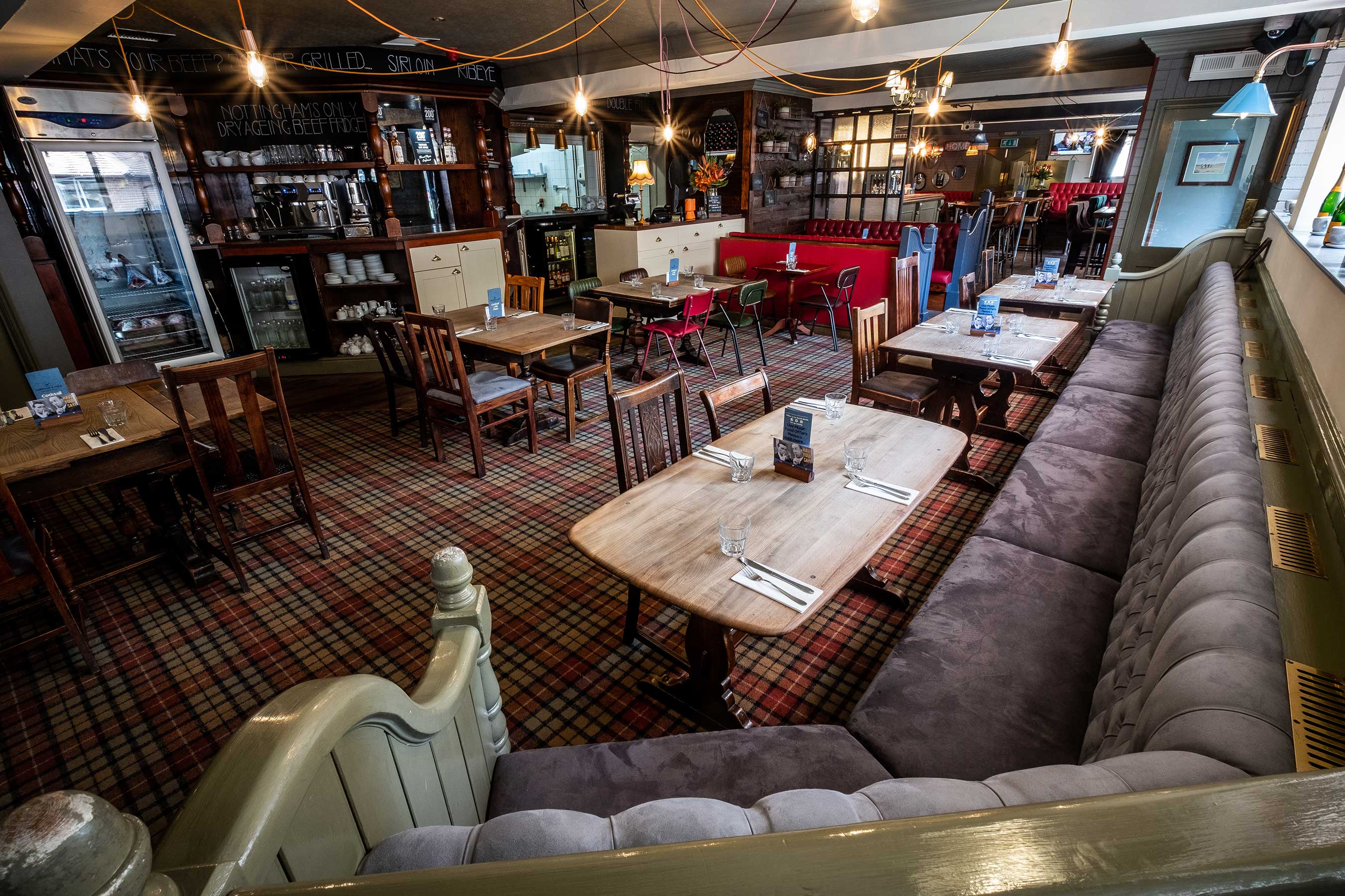 Cozy Upstairs Function Room with plush seating for intimate meetings and events.