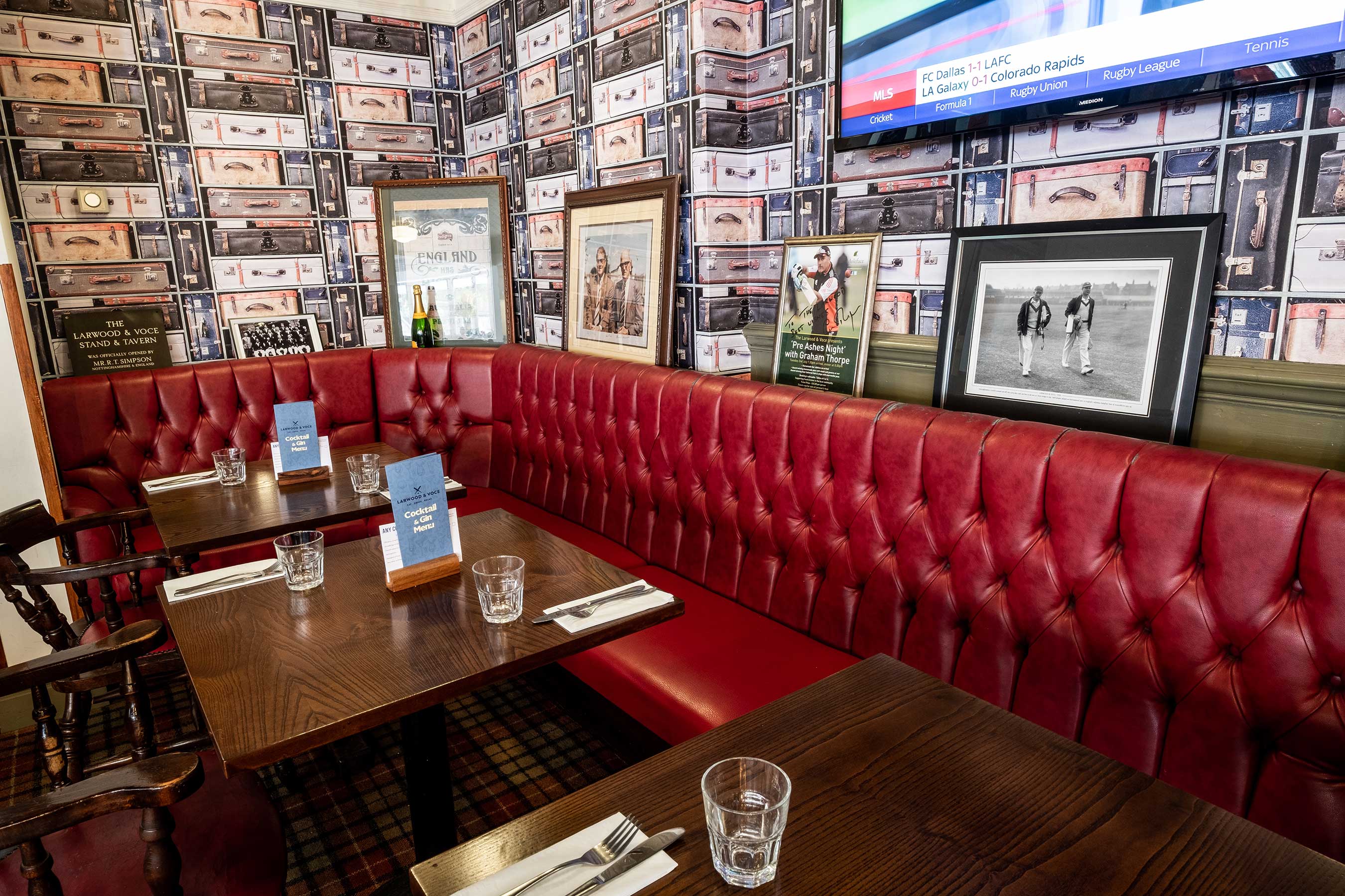 Private hire Upstairs Function Room with red leather seating, ideal for meetings and events.