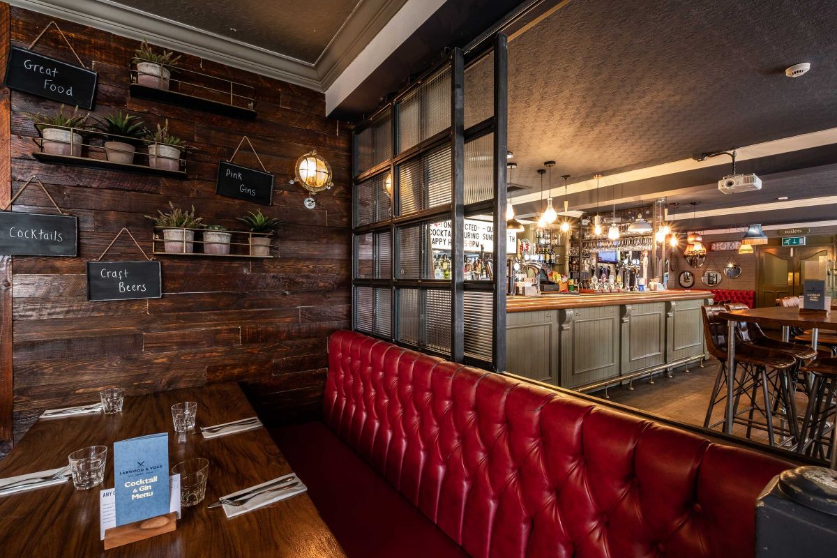 Stylish bar and restaurant with plush seating for intimate gatherings and meetings.