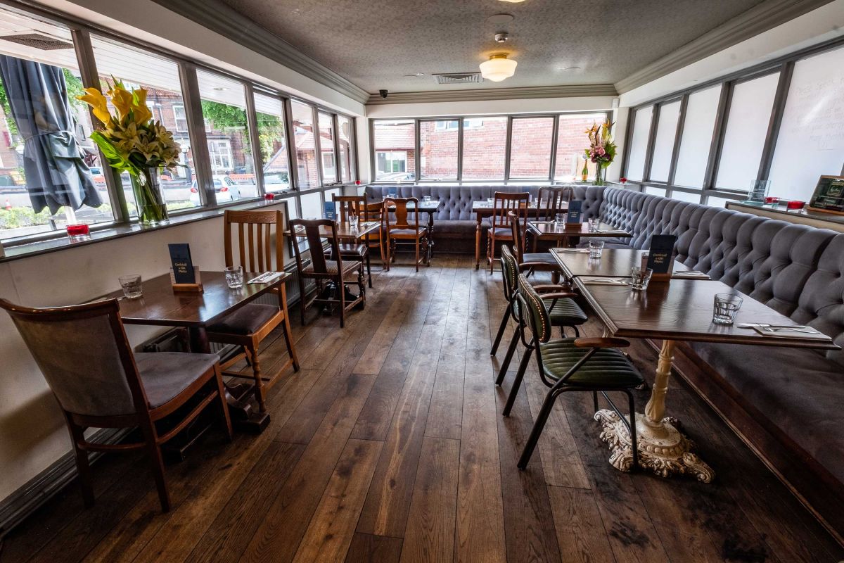 Cozy event space with flexible seating and natural light - ideal for gatherings and meetings.