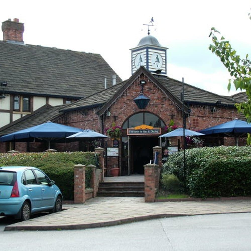Outdoor raised decking with blue umbrellas at The Larwood & Voce, perfect for events and gatherings.