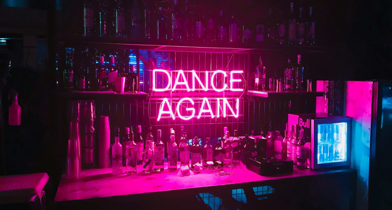 Neon-lit bar in Stealth's Room 1, perfect for nightlife events and celebrations.