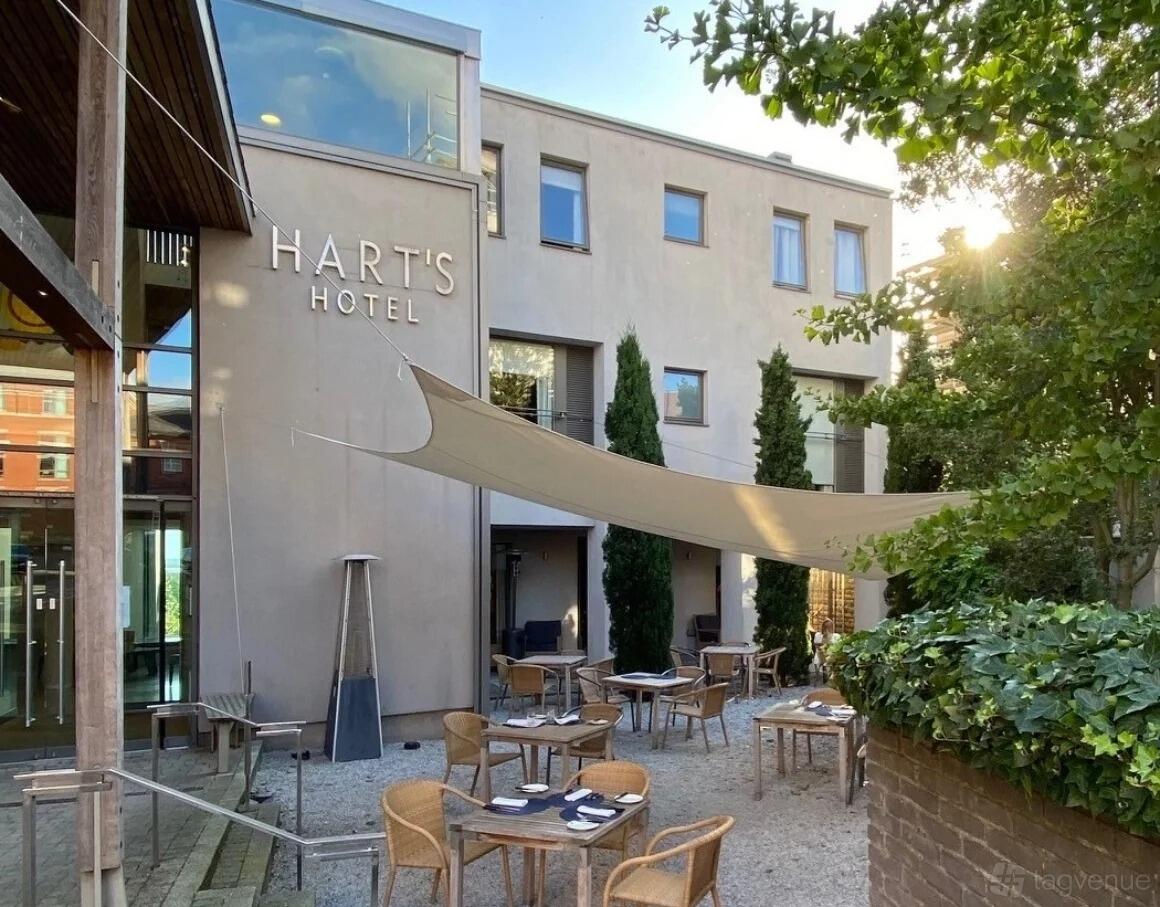 Hart's Kitchen exterior with shaded seating, ideal for elegant events and gatherings.