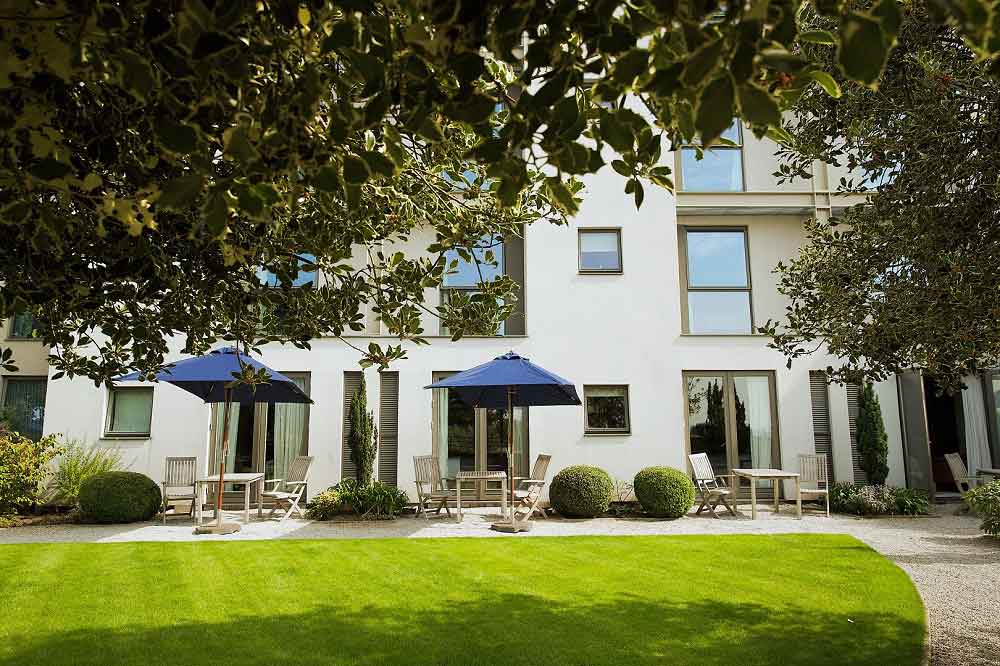 "Inviting outdoor courtyard at Hart's Hotel, perfect for networking events and breakout sessions."