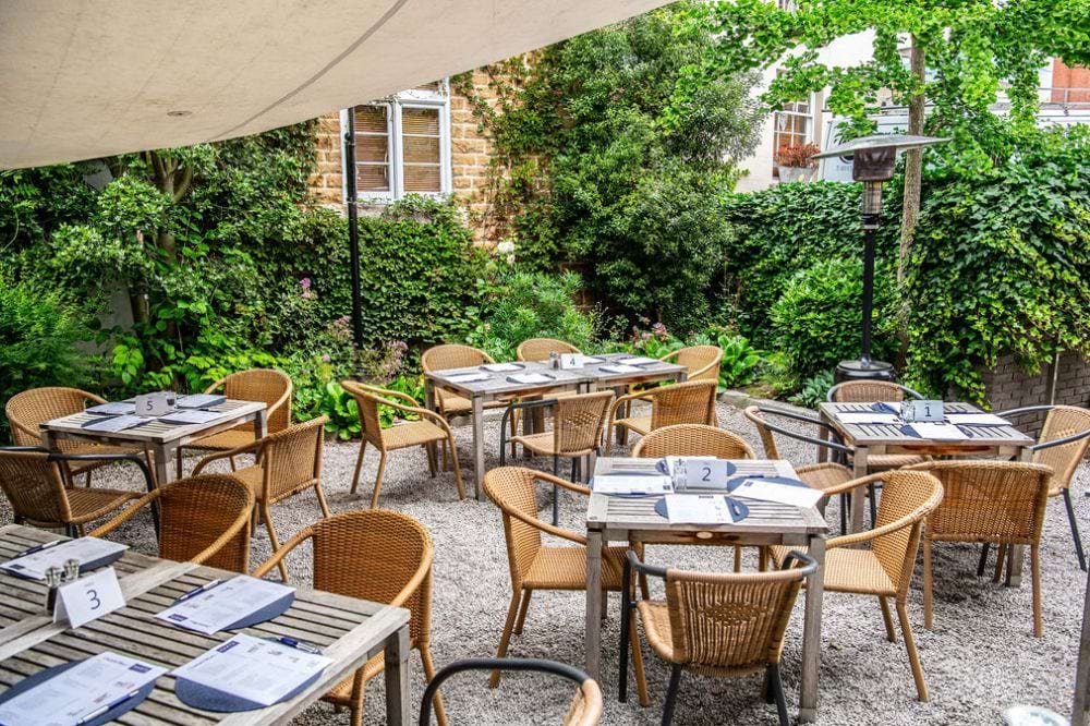 Outdoor dining area at Hart's Hotel, perfect for networking events and intimate gatherings.