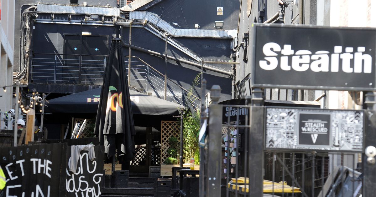 Versatile outdoor venue with black decor, ideal for networking and casual events.