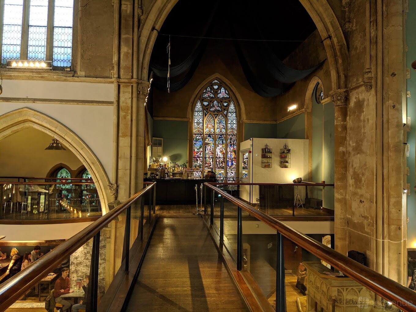 Mezzanine in Pitcher & Piano: historic venue with stained glass for events and gatherings
