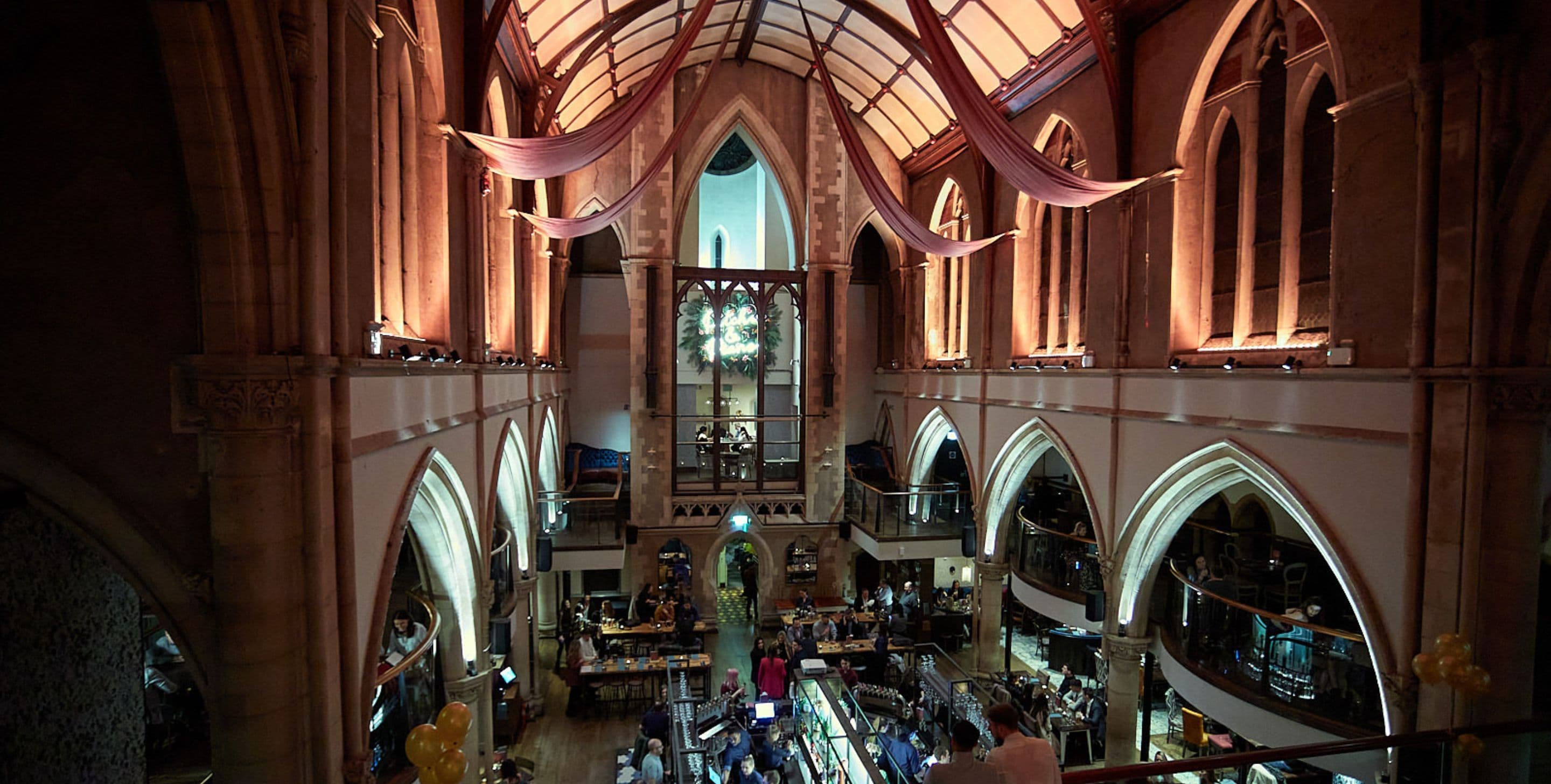 Terrace Bar at Pitcher & Piano: elegant venue with high ceilings for events and gatherings.