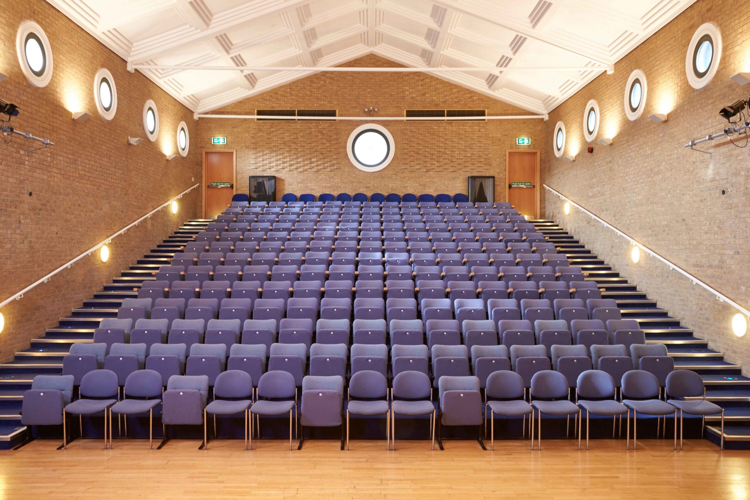 Auditorium with tiered seating and natural light at Lakeside Arts, Nottingham University.