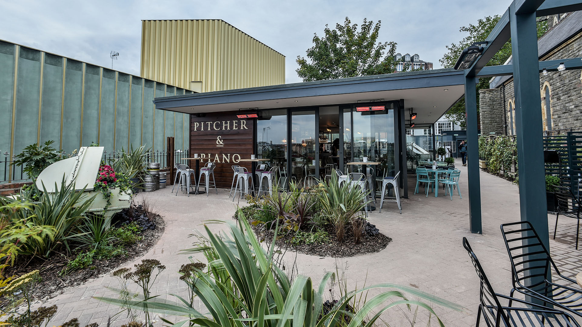 Terrace Bar at Pitcher & Piano: vibrant outdoor venue for casual meetings and events.