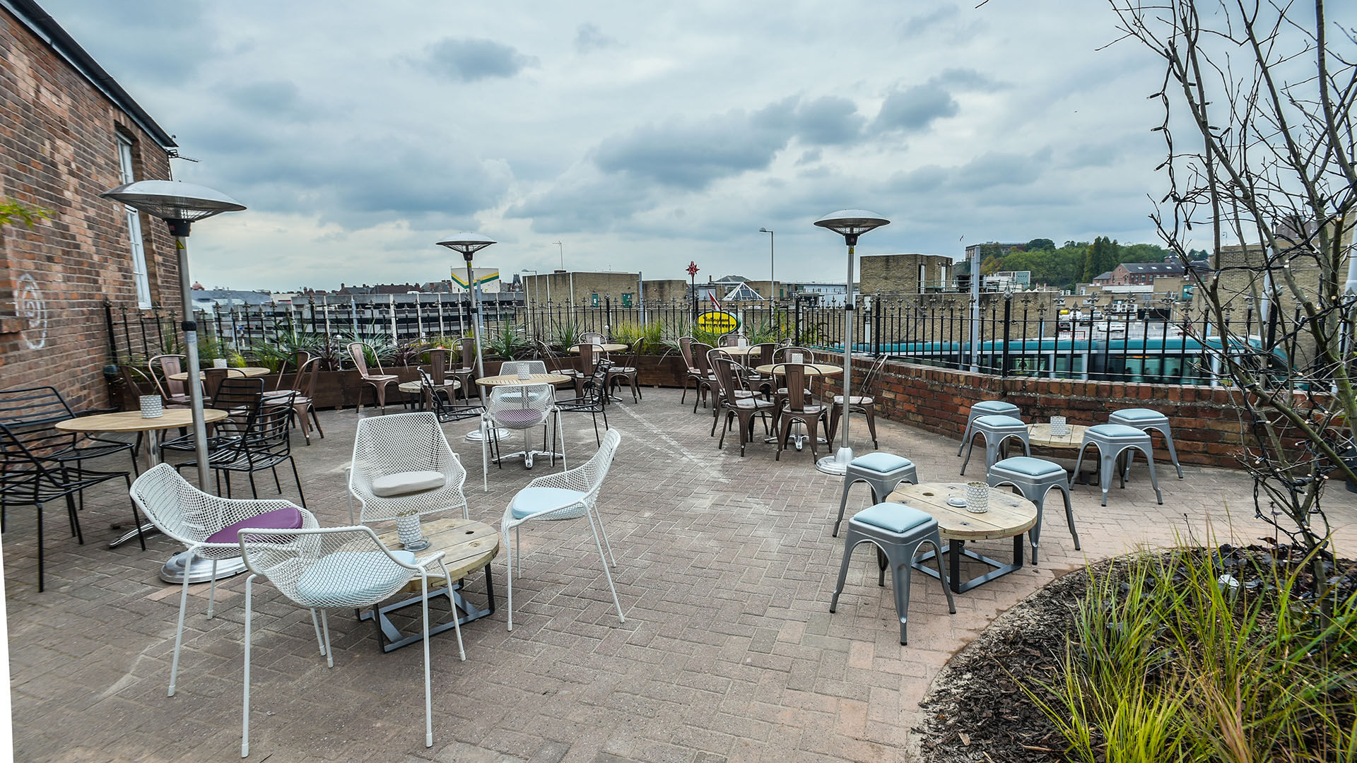 Outdoor Terrace Bar at Pitcher & Piano, ideal for casual events with scenic views.