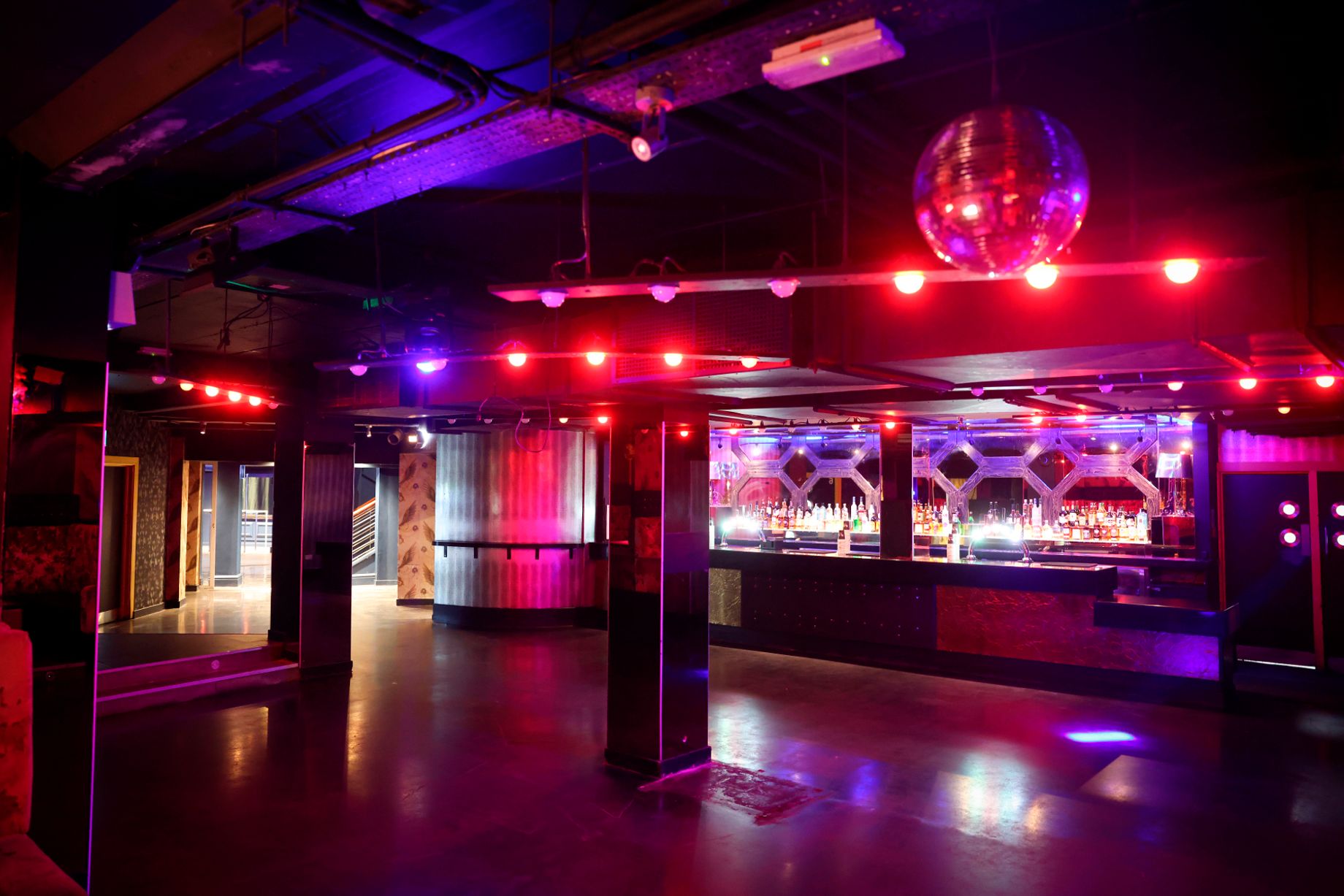 Vibrant event space at Palais Nottingham with dramatic lighting for parties and corporate gatherings.