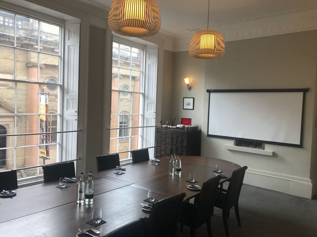 Flocc Room in Lace Market Hotel, featuring a wood conference table for corporate meetings.