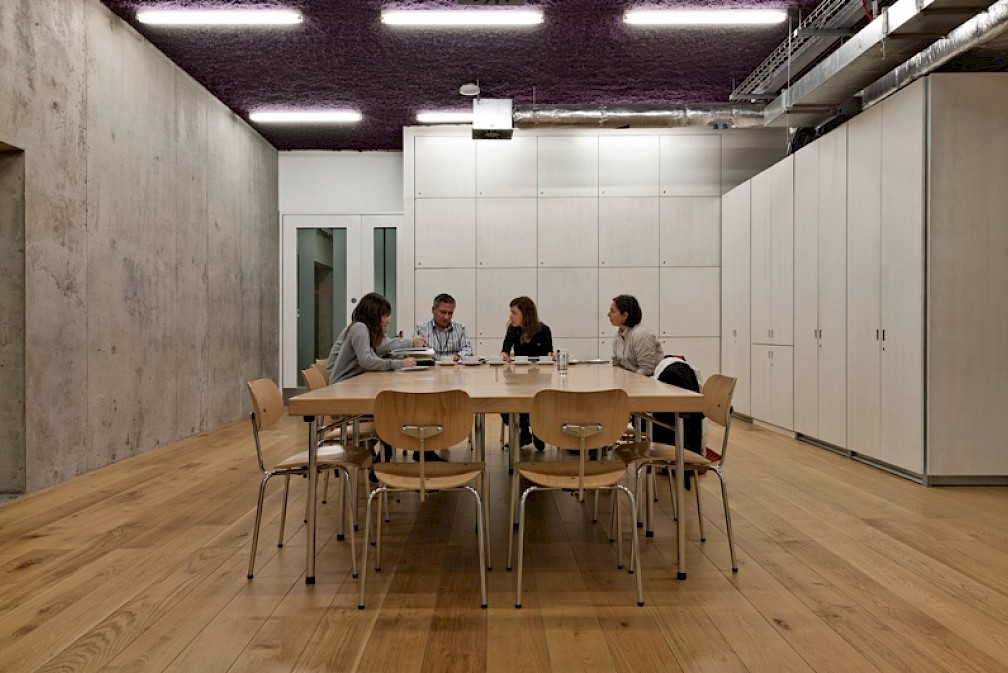 Modern meeting room in Nottingham Contemporary with a wooden table for collaborative events.