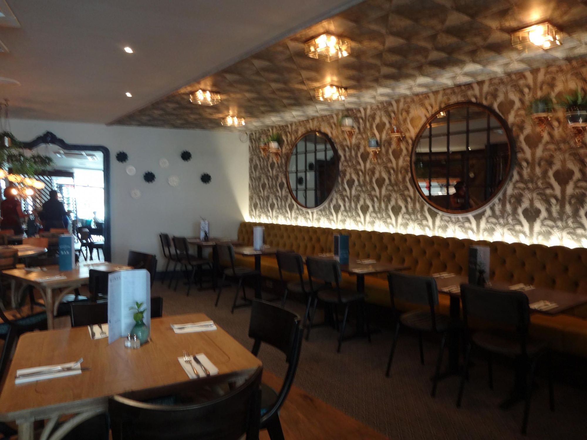 Stylish dining space with plush seating at The Snug, perfect for events and gatherings.