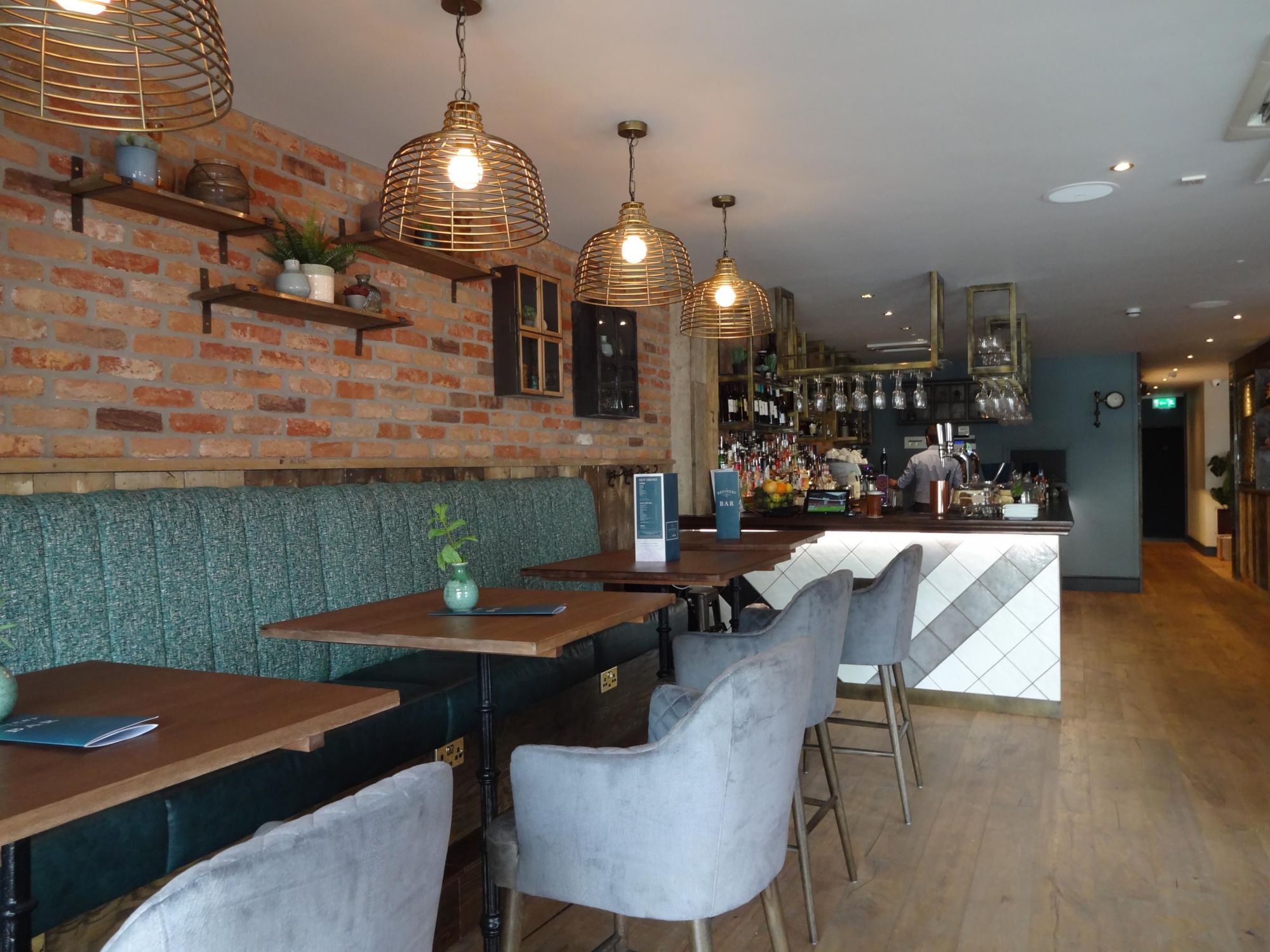 Cozy restaurant setting in The Snug, ideal for intimate meetings and small events.