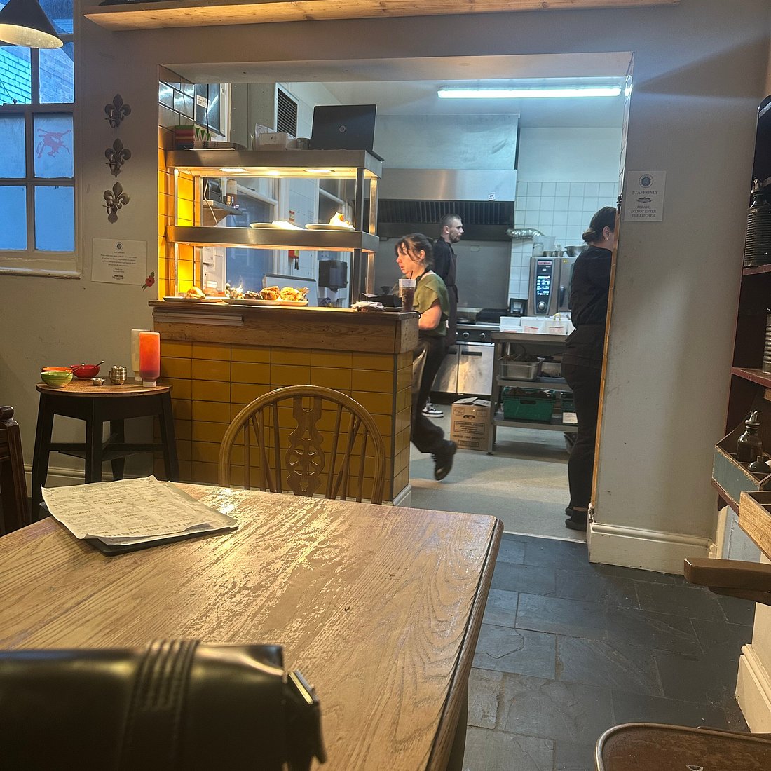 Vibrant kitchen at Downstairs Pub & Microbrewery for dynamic dining events.