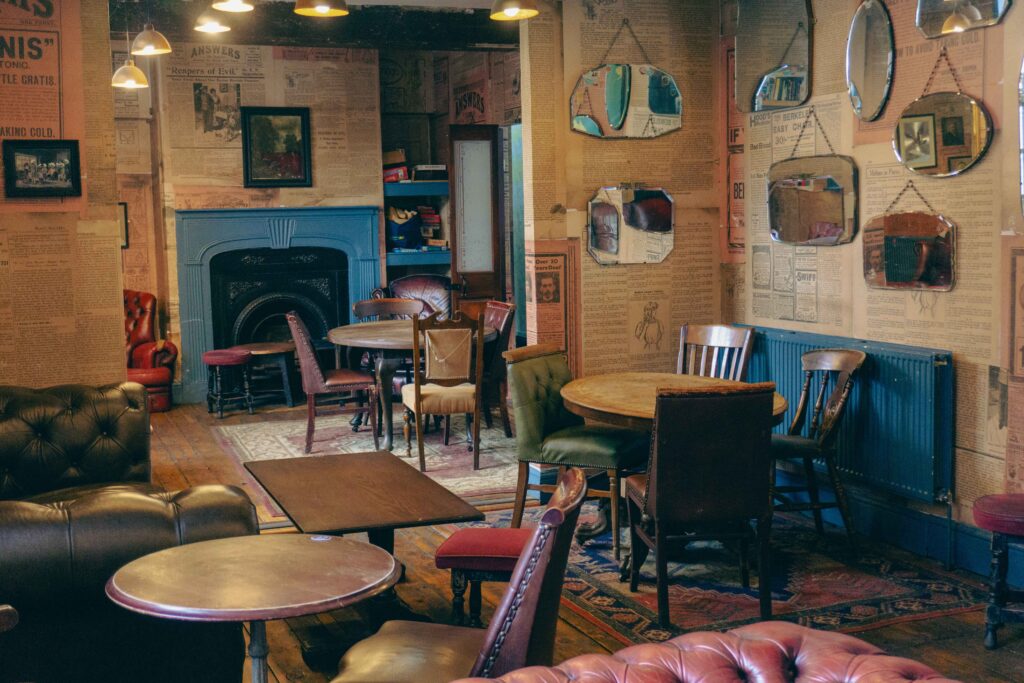 Cozy vintage pub event space with eclectic decor, ideal for gatherings and networking.