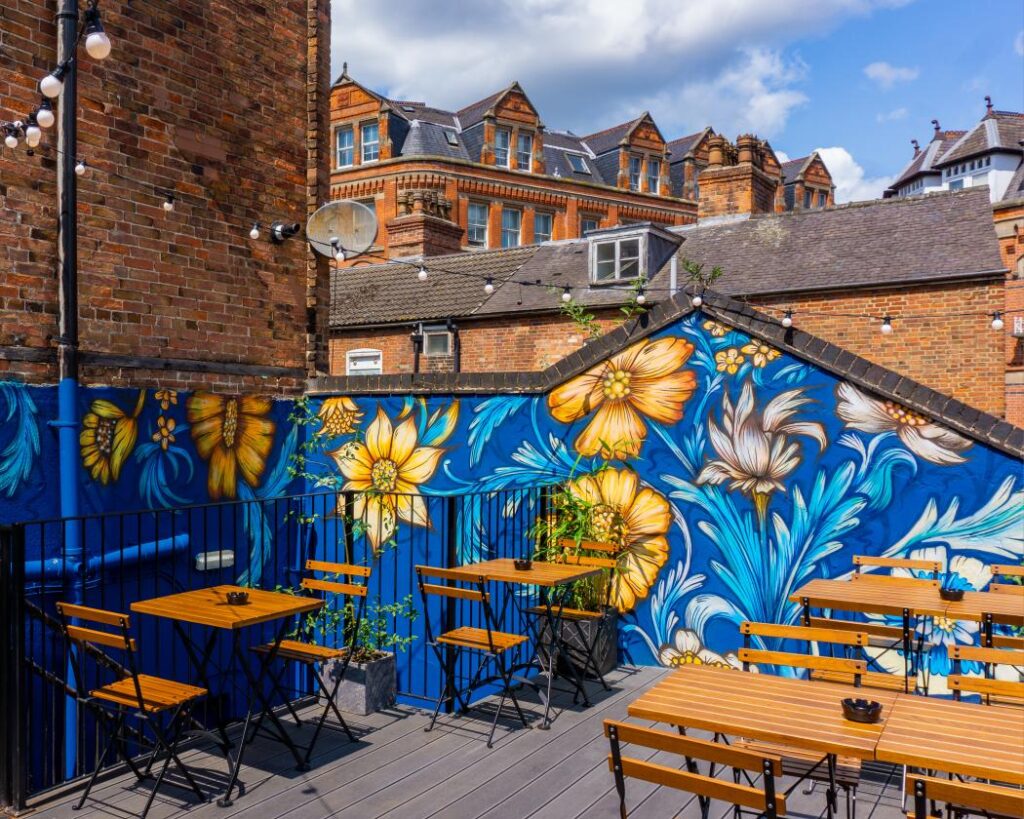 Hidden Rooftop Terrace with mural, ideal for casual meetings and events at The Angel Microbrewery.