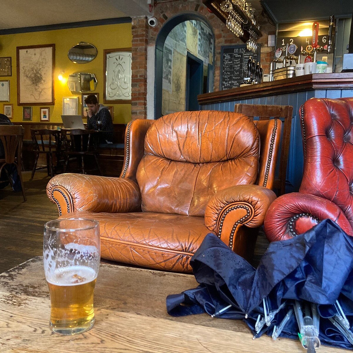 Cozy leather seating at The Chesterfield Lounge, perfect for meetings and casual gatherings.